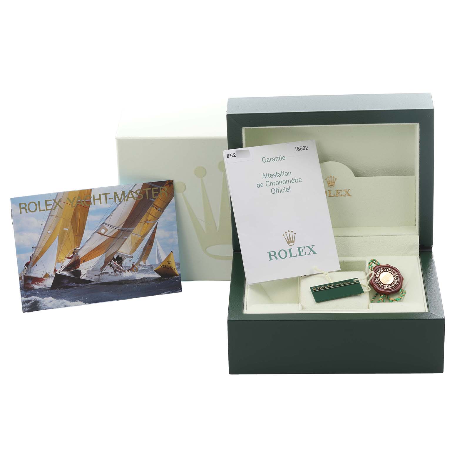 The image shows accessories for the Rolex Yacht-Master 16622 Men
s Stainless Steel Silver Dial 16622 Men
s Stainless Steel Silver Dial, including the box, warranty card, and tags, from a frontal angle.
