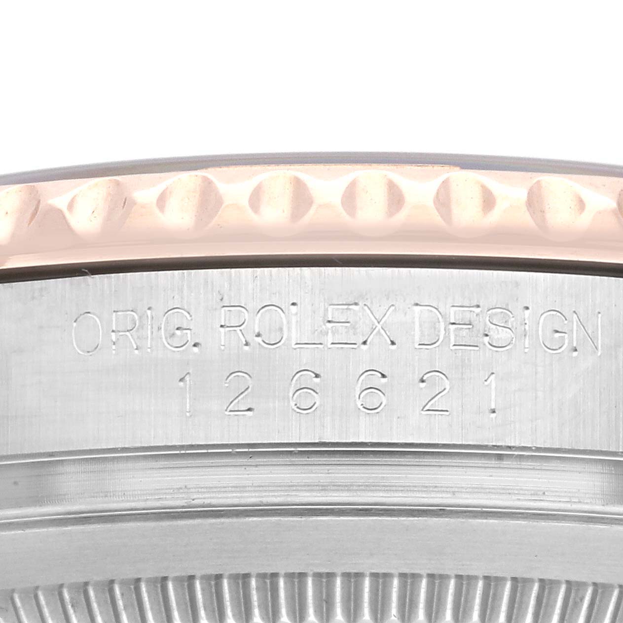 The image shows a close-up of the engraved side and edge of the Rolex Yacht-Master 126621 Men's Steel and Gold (two tone) Black Dial 126621 Men's Steel and Gold (two tone) Black Dial bezel.