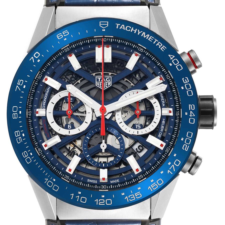 The Tag Heuer Carrera watch is shown from the front, highlighting the face, dials, and tachymetric bezel.