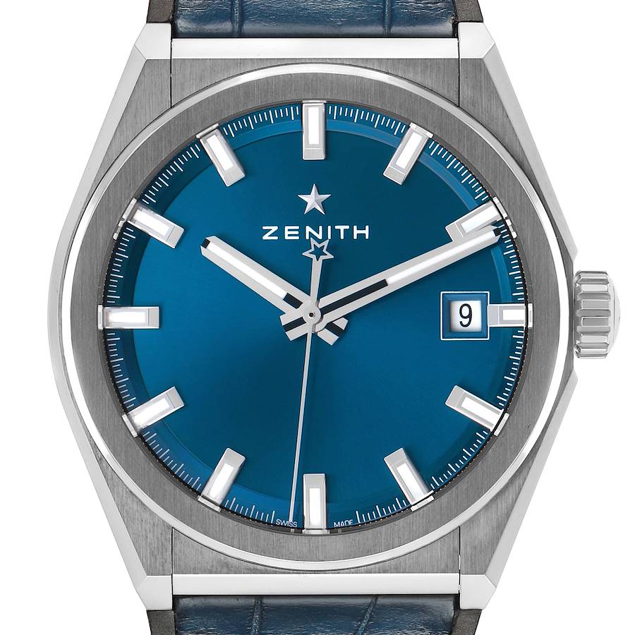 The Zenith Defy 95.9000.670/51 Men's Titanium Blue Dial watch is shown straight-on, highlighting the blue dial, hands, markers, and date window.