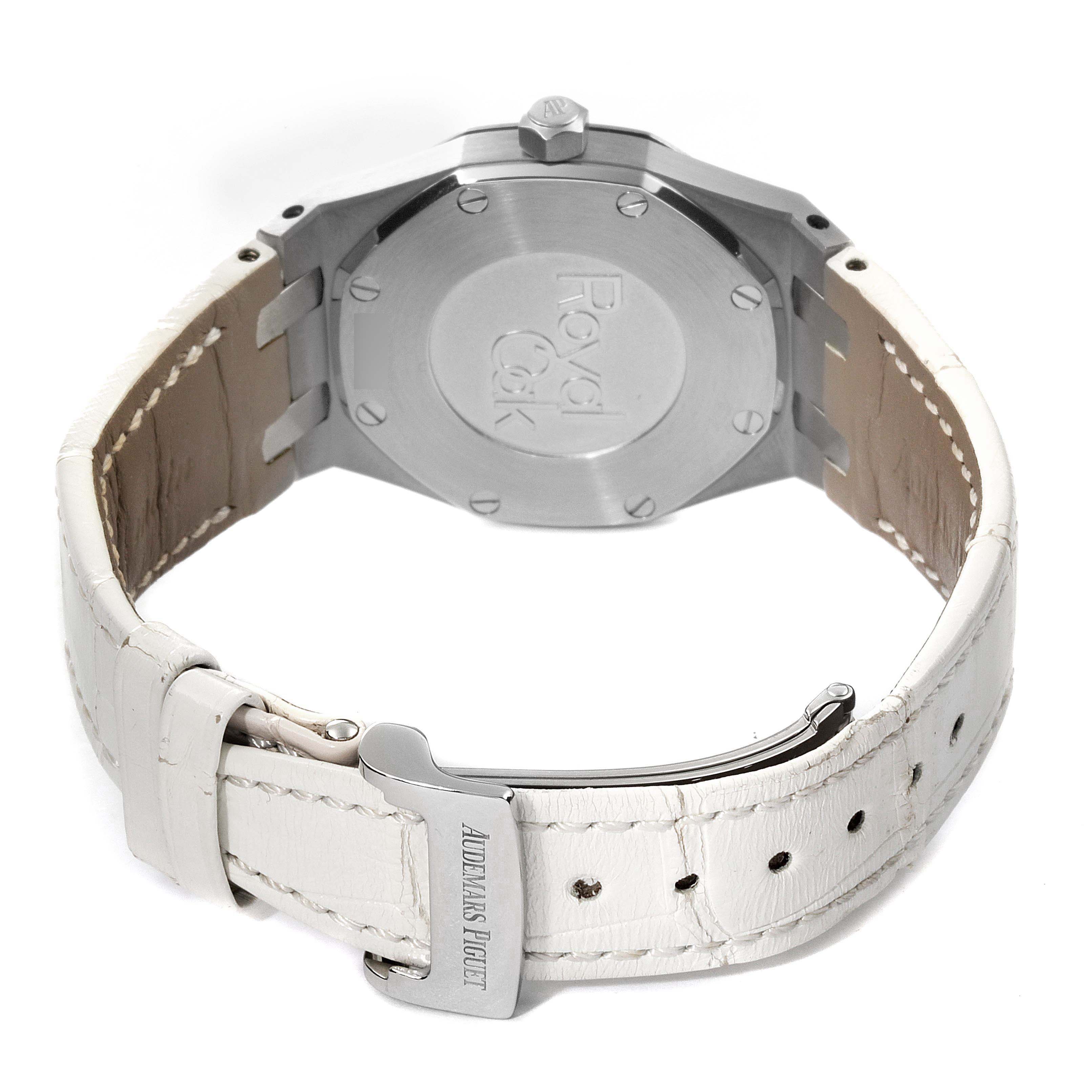 The image shows the back view of an Audemars Piguet Royal Oak 67651ST.ZZ.1261ST.01 Women's Stainless Steel Silver Dial 67651ST.ZZ.1261ST.01 Women's Stainless Steel Silver Dial watch with a white leather strap and a visible buckle.