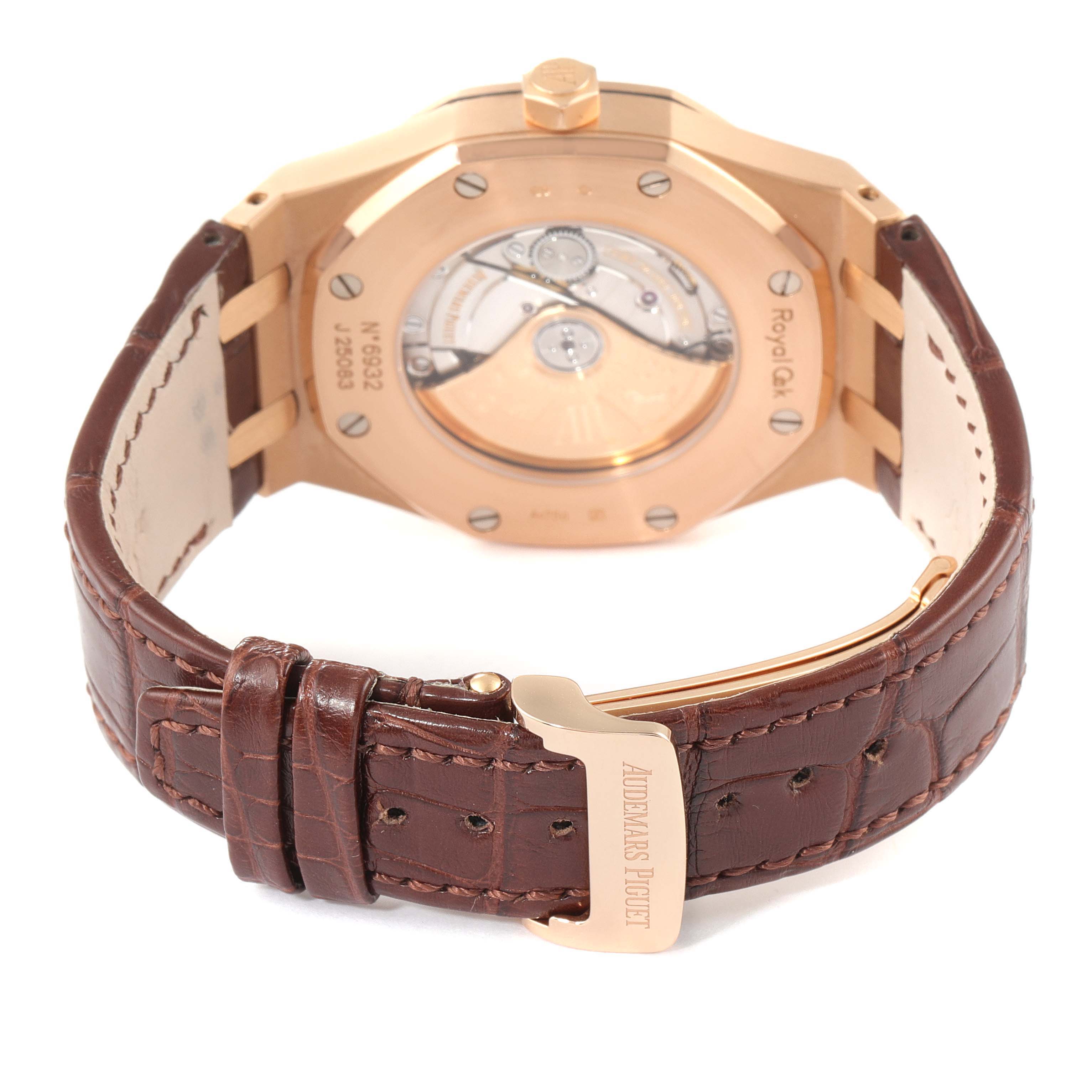 The image shows the back of the Audemars Piguet Royal Oak 15400OR.OO.D088CR.01 Men's Rose Gold White Dial 15400OR.OO.D088CR.01 Men's Rose Gold White Dial watch, highlighting its case, movement, and leather strap with the brand's buckle.