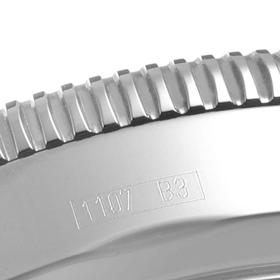 This close-up image shows the side edge of the bezel and part of the case with an engraving on the Breitling Superocean A17320 Men's Stainless Steel Brown Dial A17320 Men's Stainless Steel Brown Dial watch.