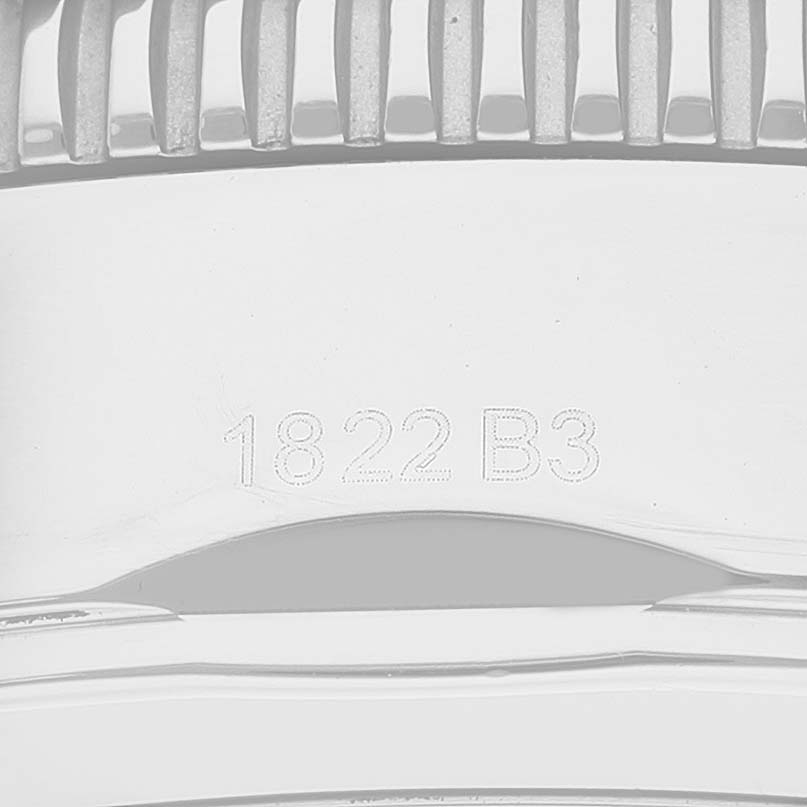 The image shows the serial number engraving on the bezel of a Breitling Superocean A13313 Men's Stainless Steel Blue Dial A13313 Men's Stainless Steel Blue Dial watch.