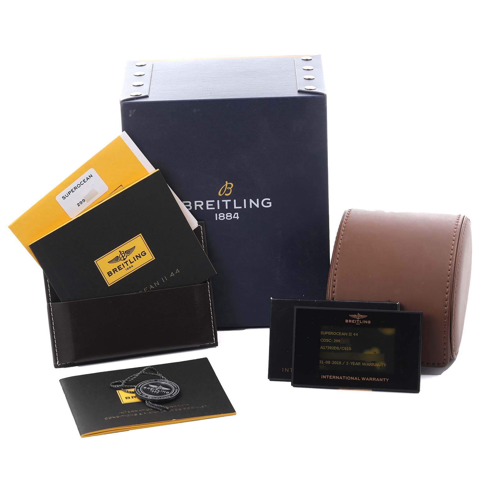 The image shows the Breitling Superocean A17392 Men's Stainless Steel Blue Dial A17392 Men's Stainless Steel Blue Dial box, warranty cards, manuals, and a brown watch case at a slight angle.