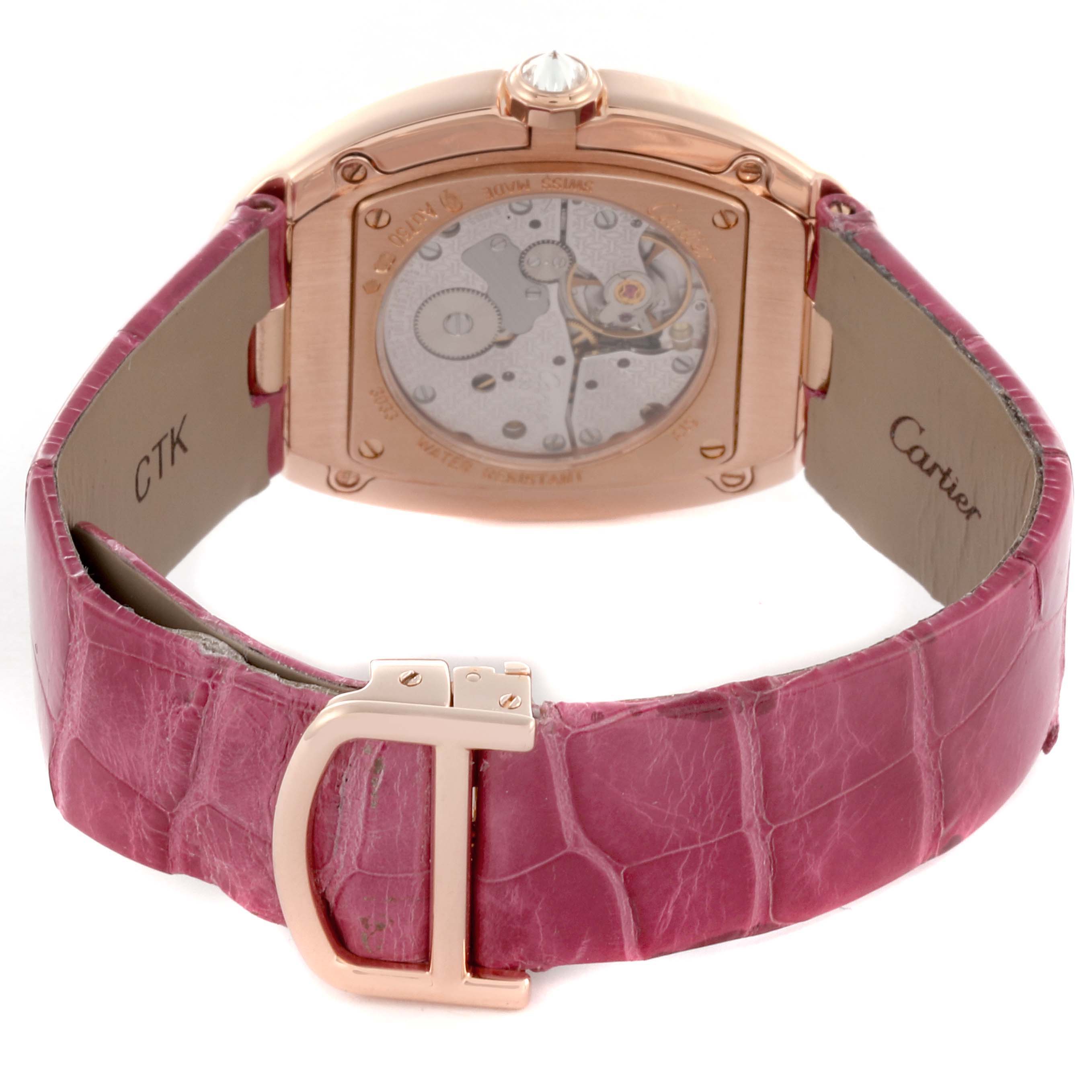 The Cartier Baignoire WB520005 Women
s Rose Gold Silver Dial WB520005 Women
s Rose Gold Silver Dial watch is shown from the back, highlighting the movement and pink strap with a rose gold clasp.