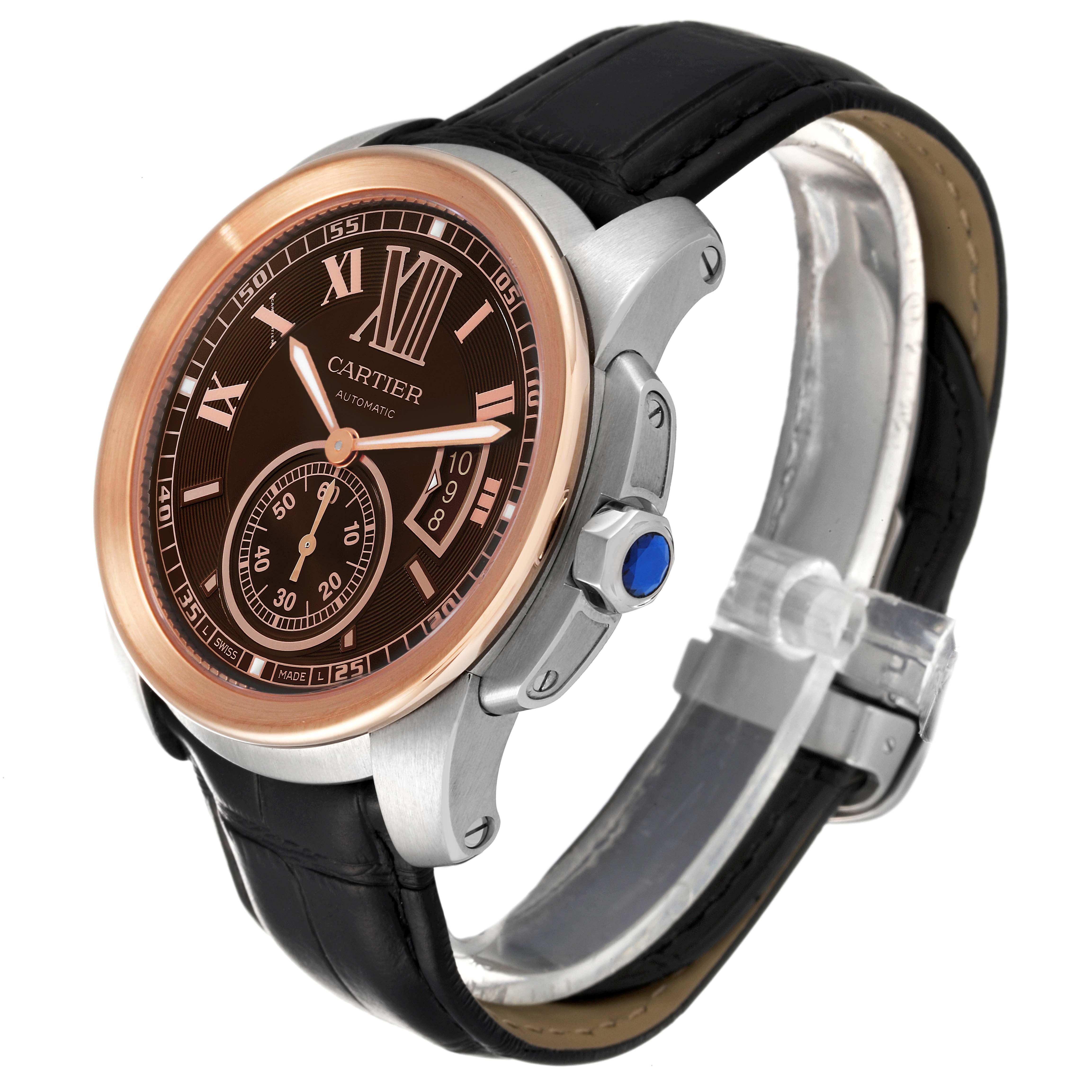 The image shows a Calibre de Cartier watch by Cartier at a three-quarter angle, highlighting its face, bezel, crown, and strap.