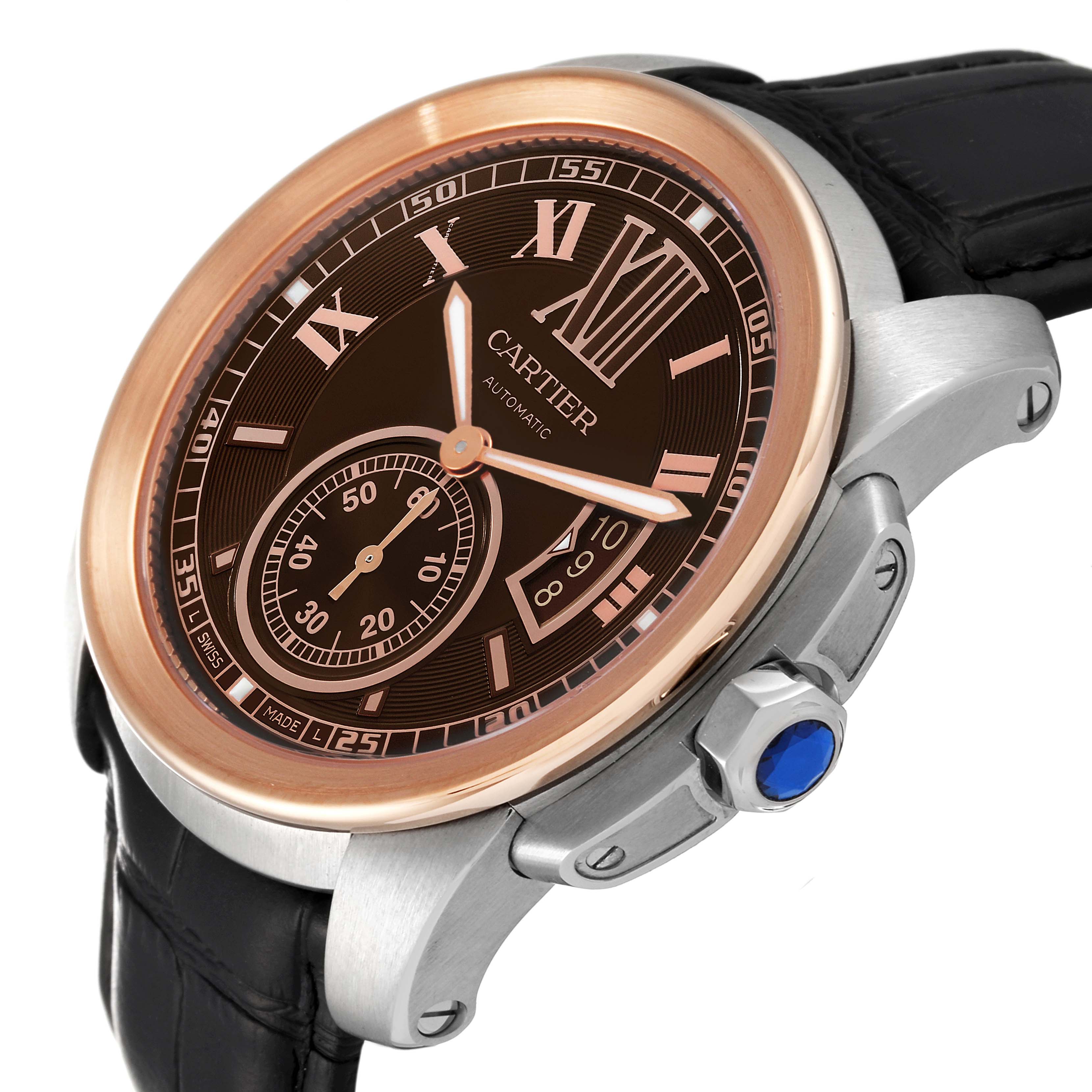 The image shows a close-up angle of a Calibre de Cartier watch by Cartier, highlighting the dial, crown, and part of the strap.