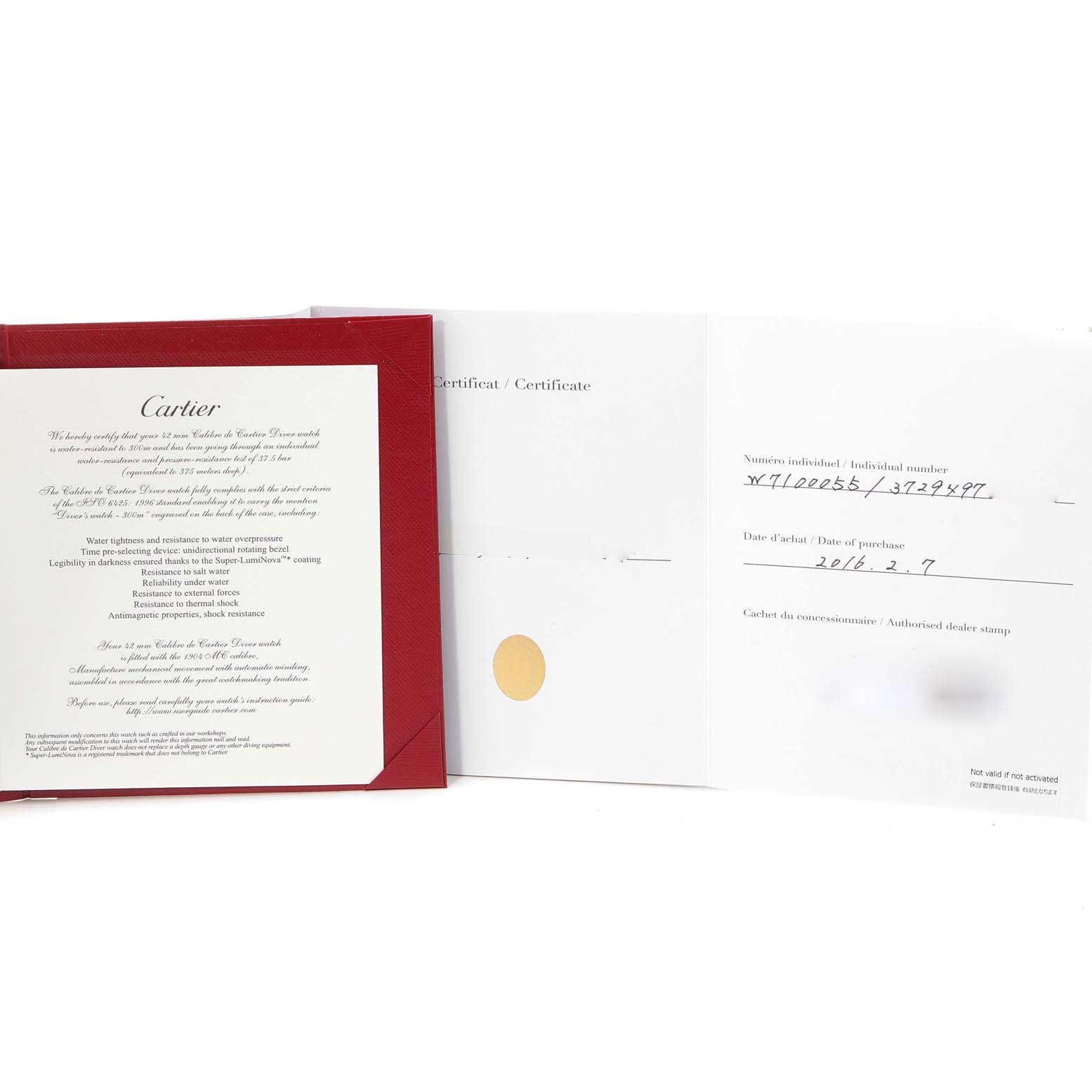 The image shows the warranty and authentication papers for a Calibre de Cartier watch by Cartier, displayed from a top-down angle.