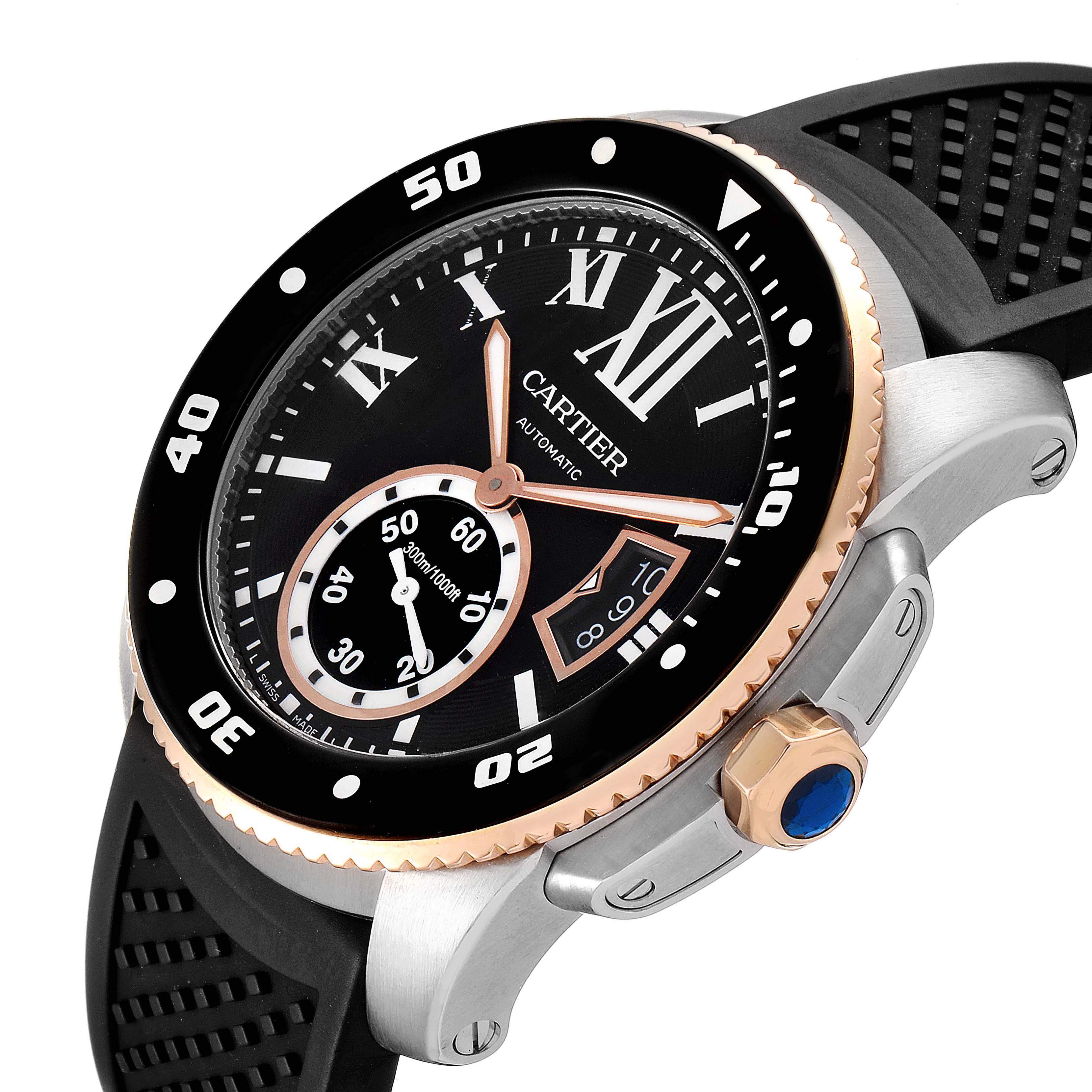 The image shows a Calibre de Cartier watch by Cartier from an angled view, highlighting the dial, bezel, crown, and rubber strap.