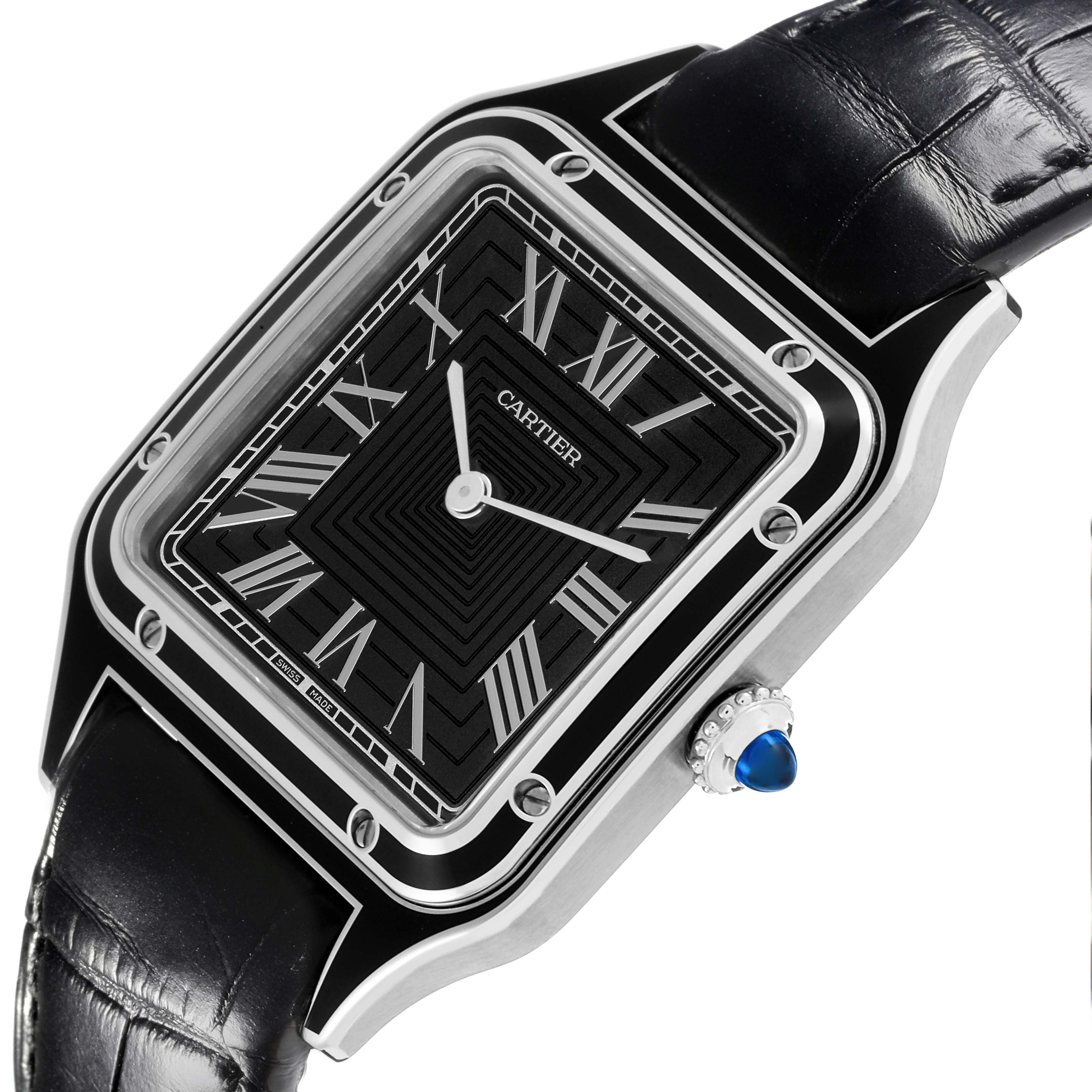 The Cartier Santos Dumont WSSA0046 Men's Stainless Steel Black Dial WSSA0046 Men's Stainless Steel Black Dial watch is shown at an angled view, highlighting the black dial, Roman numerals, and crown with sapphire cabochon.