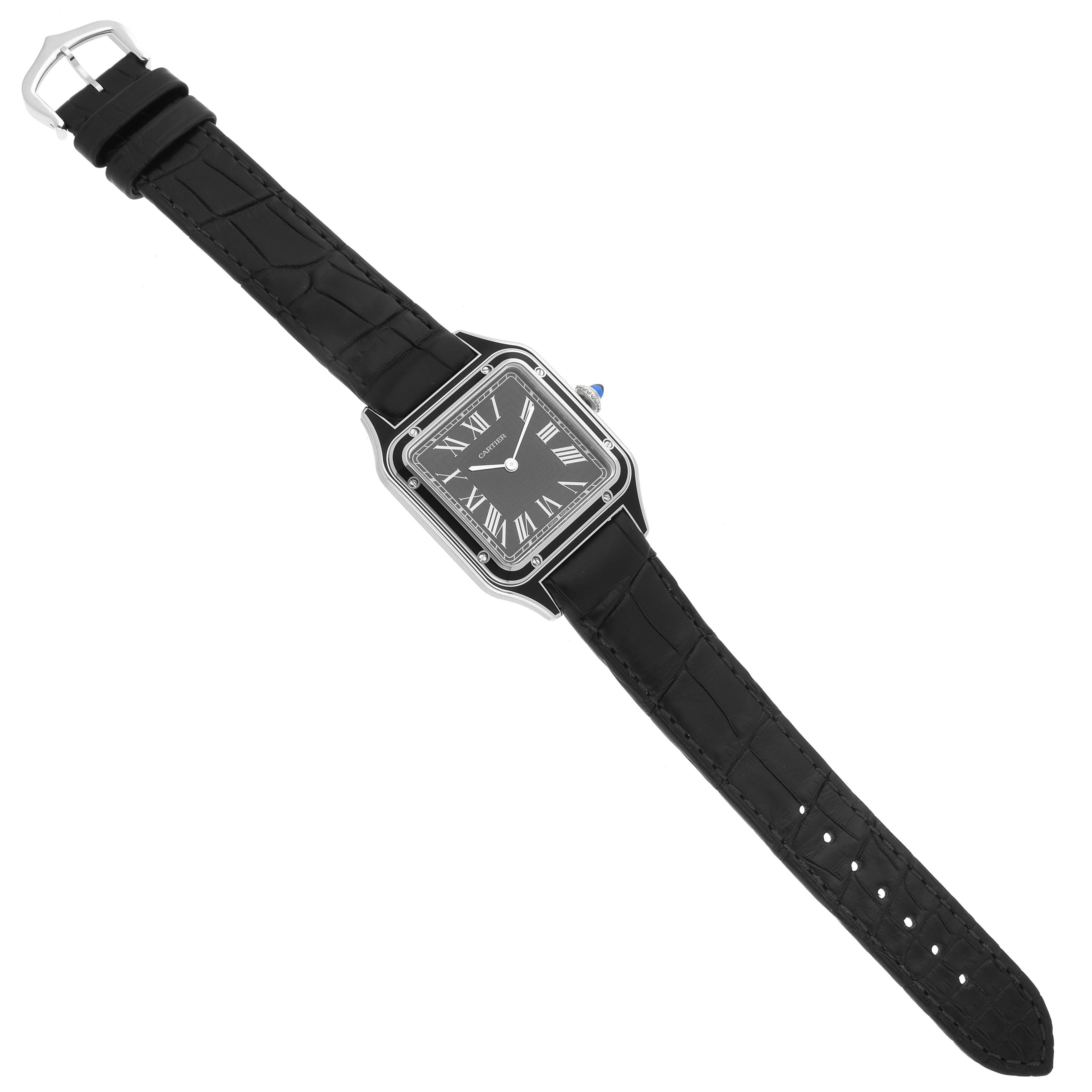 The Cartier Santos Dumont WSSA0046 Men's Stainless Steel Black Dial WSSA0046 Men's Stainless Steel Black Dial watch is shown from a top view, displaying the face, strap, and buckle.