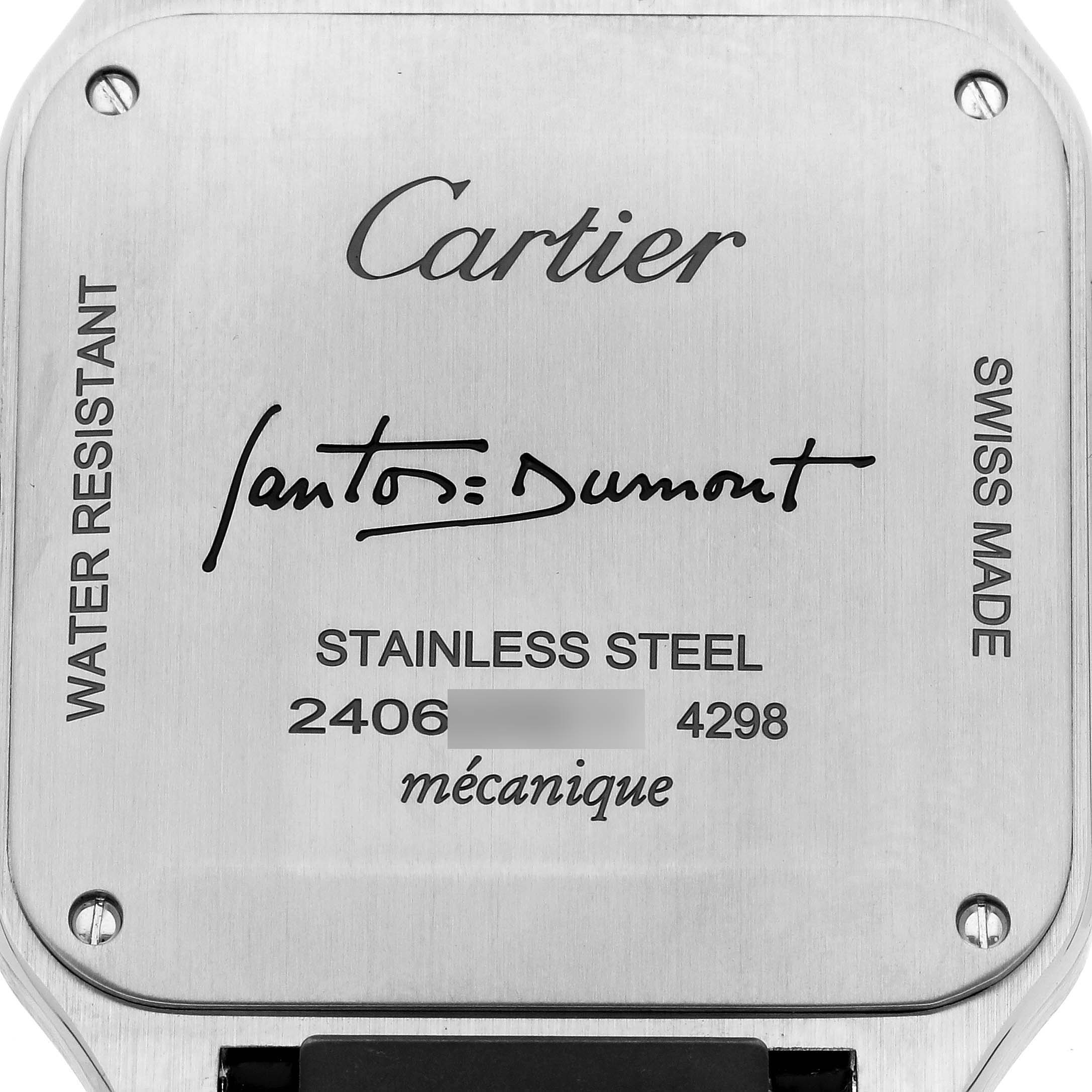 The image shows the back case of a Cartier Santos Dumont WSSA0046 Men's Stainless Steel Black Dial WSSA0046 Men's Stainless Steel Black Dial watch, highlighting its inscriptions and material.