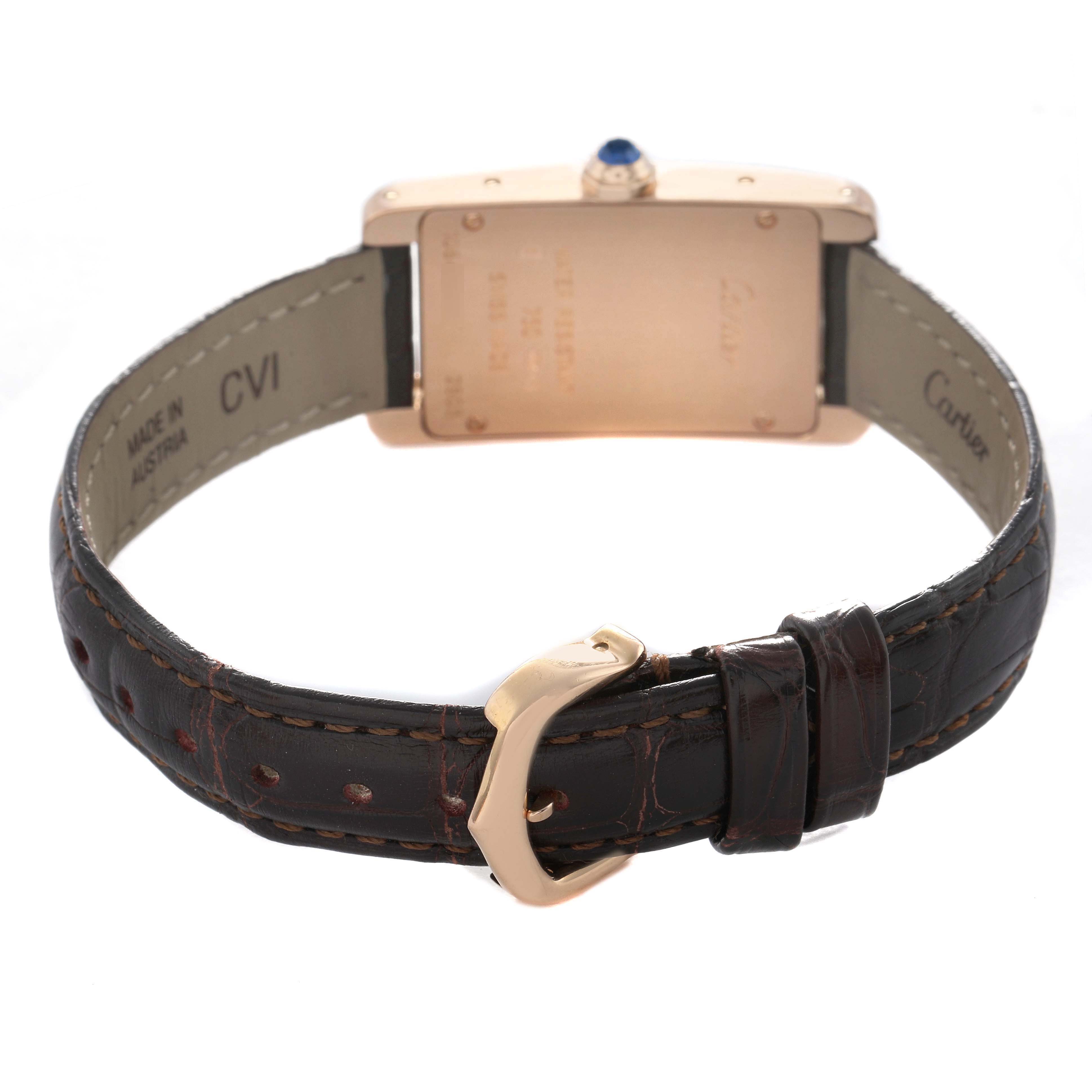 The image shows the back of the Cartier Tank Américaine watch, highlighting its buckle, strap, and case back.