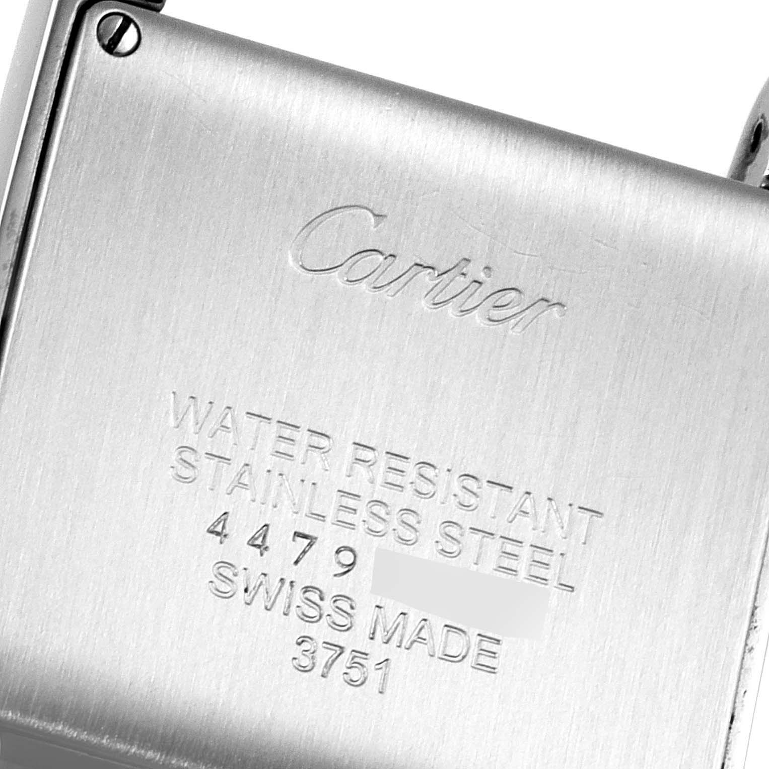 The image shows the stainless steel back case of a Cartier Tank Francaise W4TA0009 Women
s Stainless Steel Silver Dial W4TA0009 Women
s Stainless Steel Silver Dial watch, detailing its water resistance and manufacturing origin.