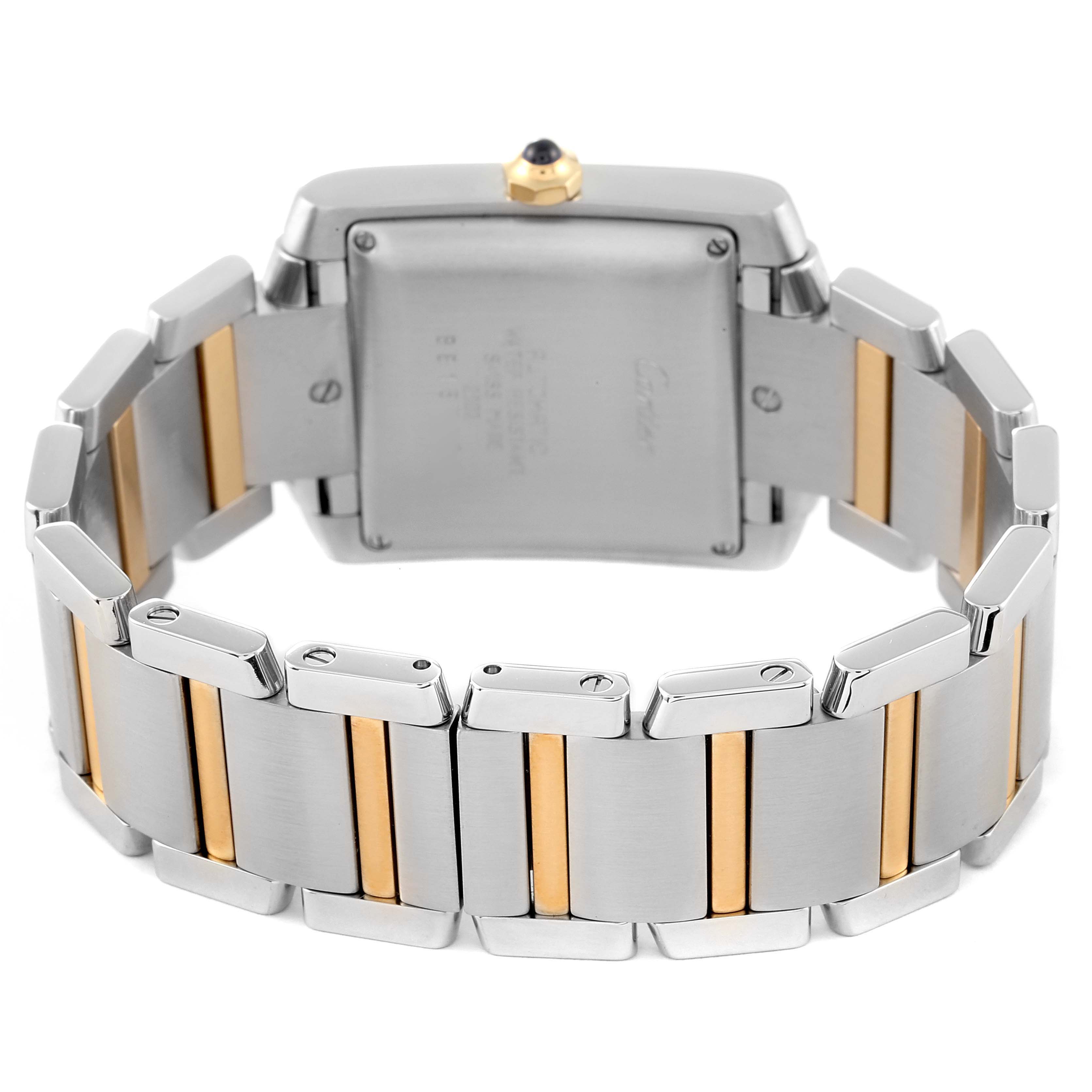 The image shows the back case and two-tone bracelet of a Cartier Tank Francaise W51005Q4 Men's Steel and Gold (two tone) Silver Dial W51005Q4 Men's Steel and Gold (two tone) Silver Dial watch at a slightly tilted angle.