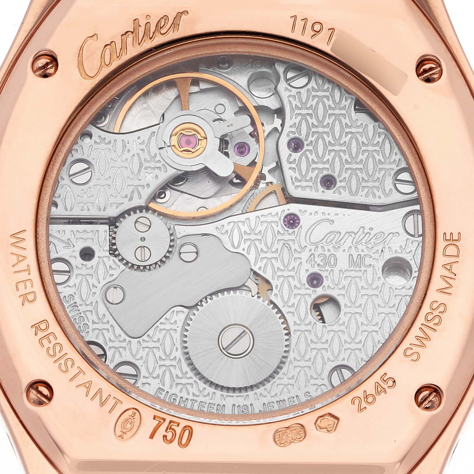 The image shows the back of the Cartier Tortue 66195 Women's Rose Gold Silver Dial 66195 Women's Rose Gold Silver Dial watch, highlighting its intricate mechanical movement and engravings.