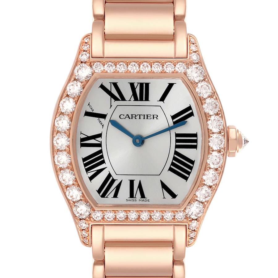 The Cartier Tortue watch is shown from a front angle, highlighting its diamond bezel and Roman numeral dial.