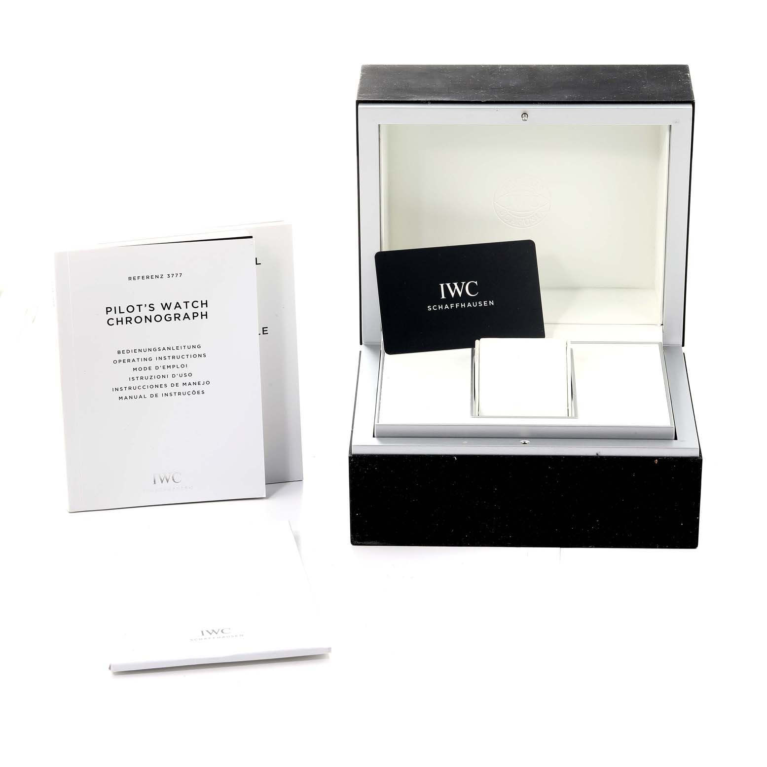 The image shows the IWC Pilot IW377719 Men's Stainless Steel Grey Dial IW377719 Men's Stainless Steel Grey Dial's Watch box, operating instructions, and warranty card from a front angle.