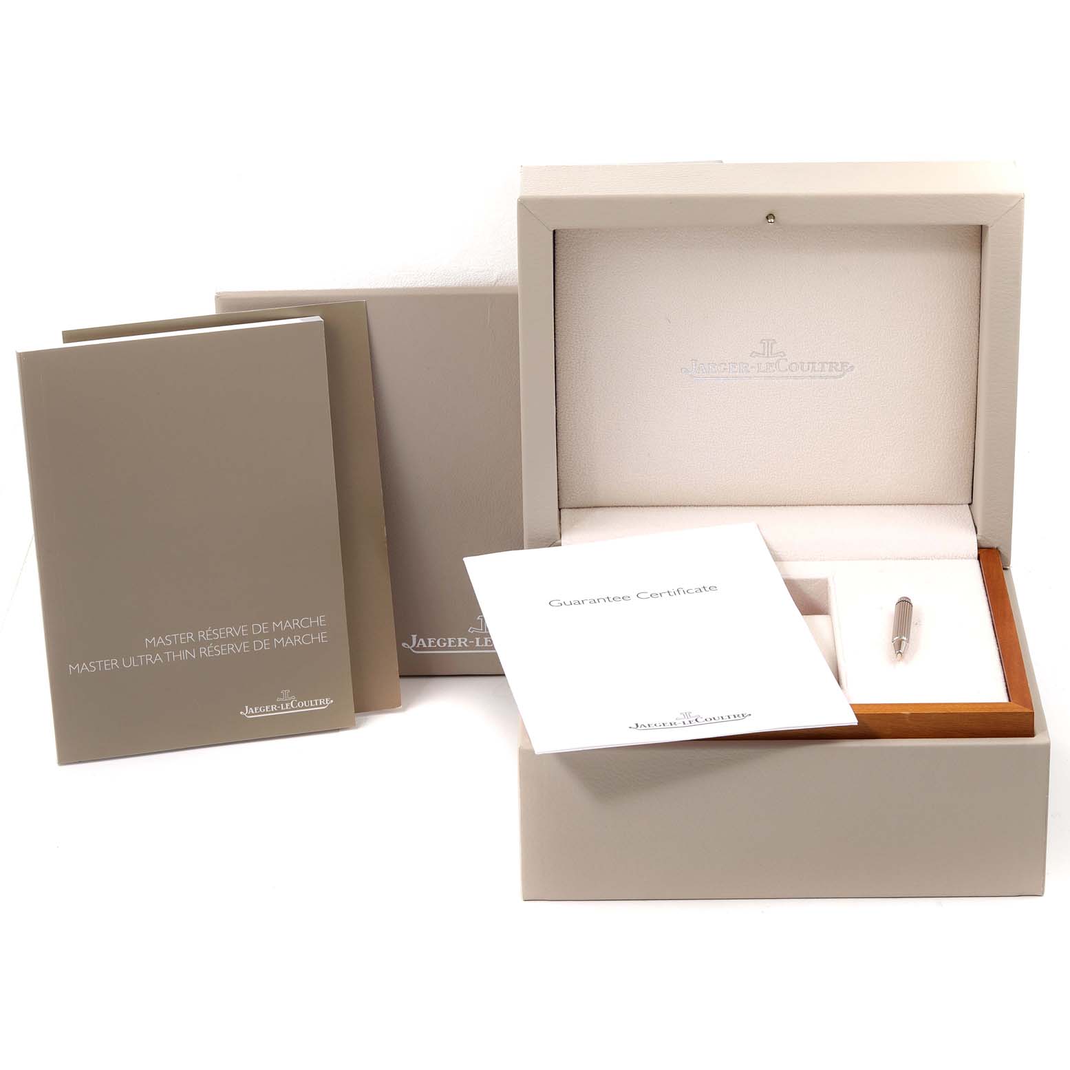 The image shows the packaging, guarantee certificate, and additional documentation for a Jaeger-LeCoultre Master model watch.