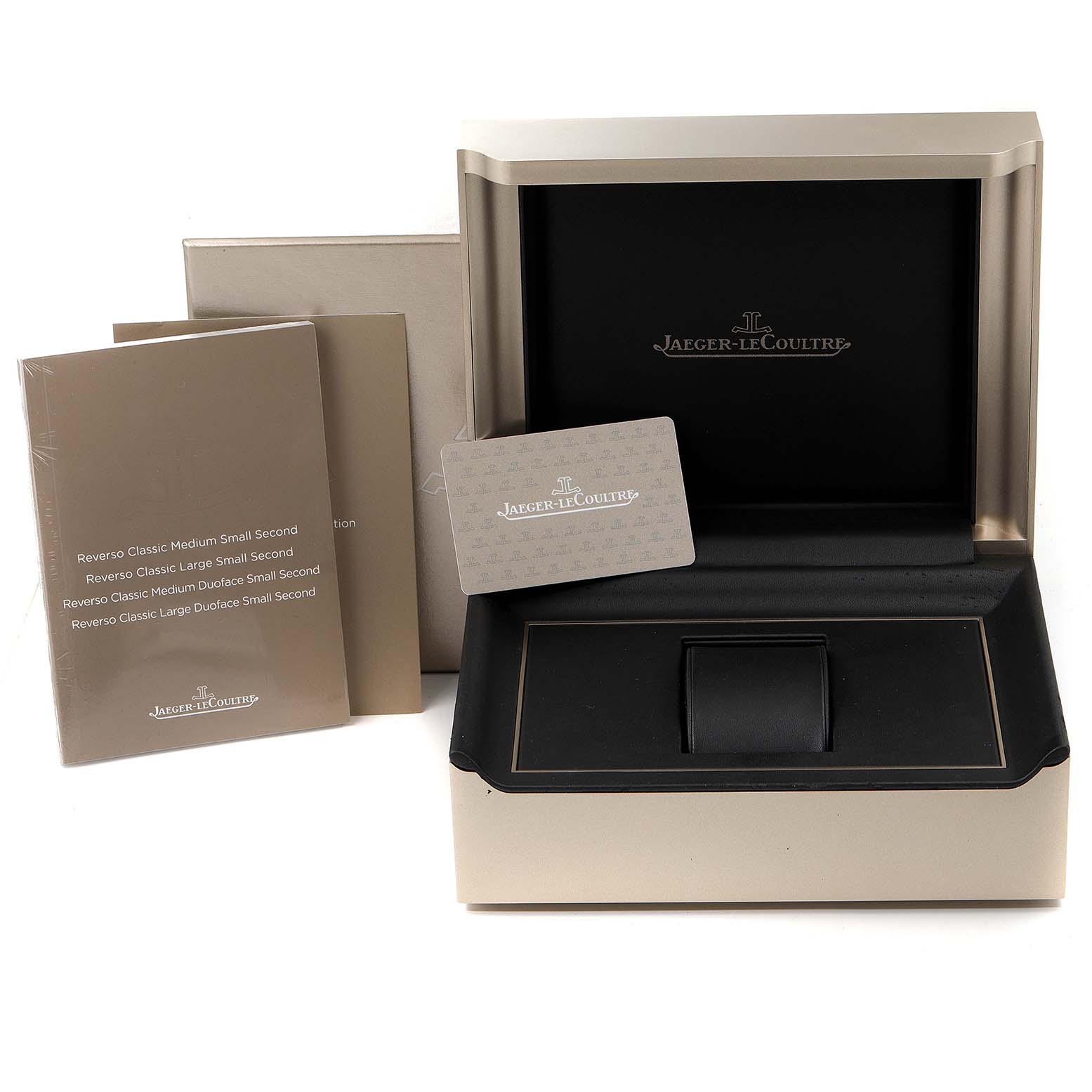 The image shows a Jaeger LeCoultre Reverso Q3858520 Men
s Stainless Steel Silver Dial Q3858520 Men
s Stainless Steel Silver Dial watch box, instruction manuals, and a warranty card from a front angle.