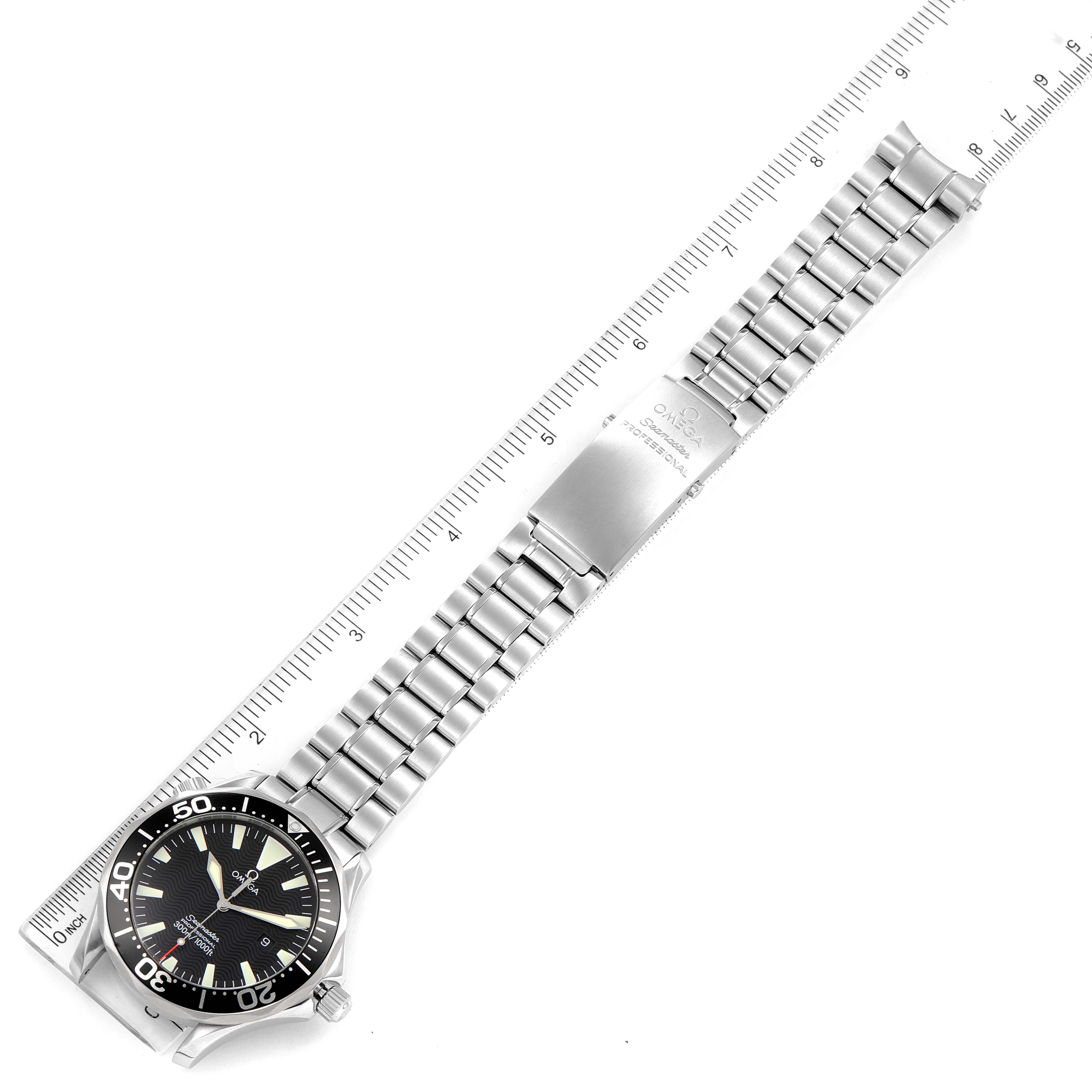 The image shows an Omega Seamaster 2264.50.00 Men's Stainless Steel Black Dial 2264.50.00 Men's Stainless Steel Black Dial watch laid flat, displaying the face, bezel, stainless steel bracelet, and clasp, alongside a ruler.