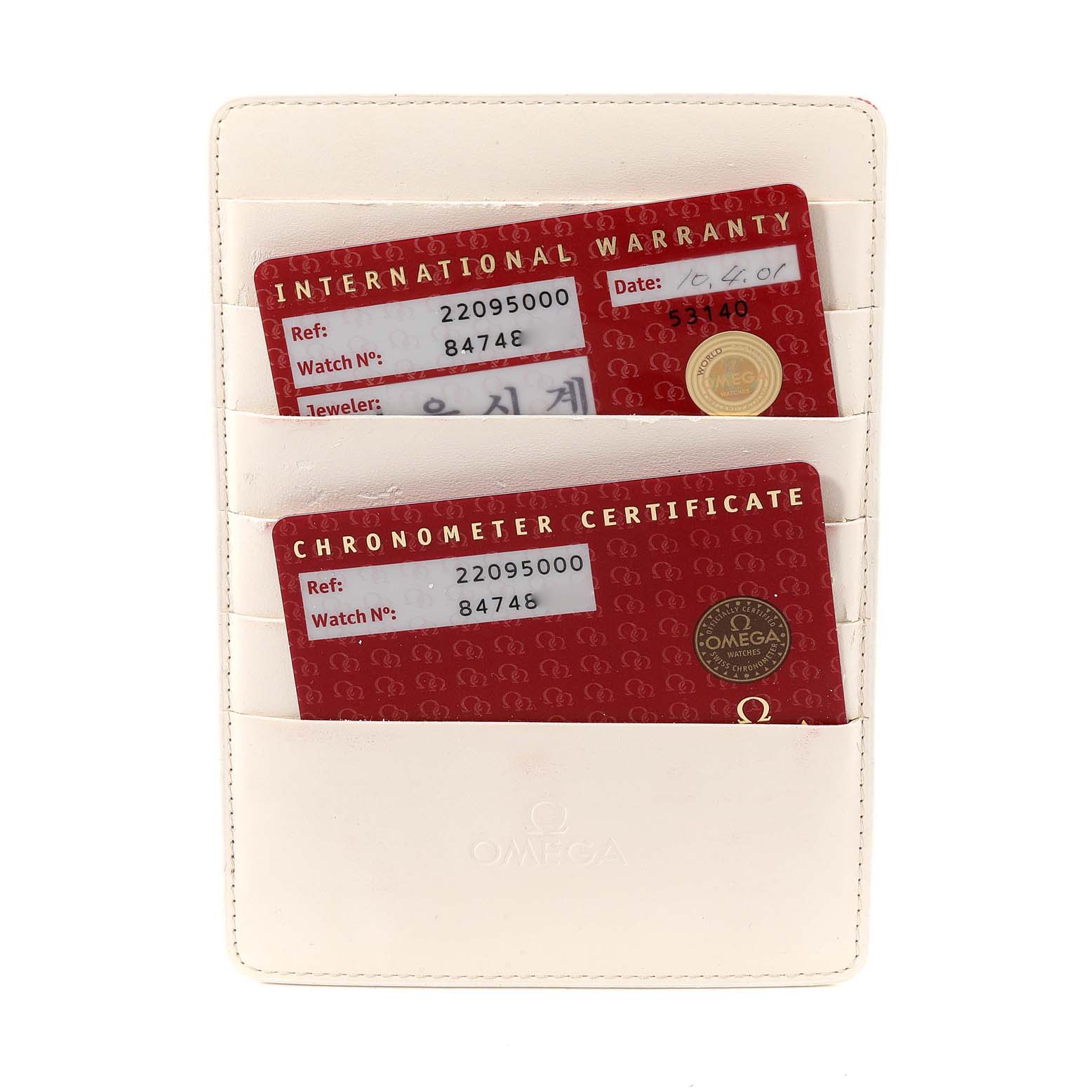 The image shows warranty and chronometer certificate cards for the Omega Planet Ocean 2209.50.00 Men
s Stainless Steel Black Dial 2209.50.00 Men
s Stainless Steel Black Dial model in a white cardholder.