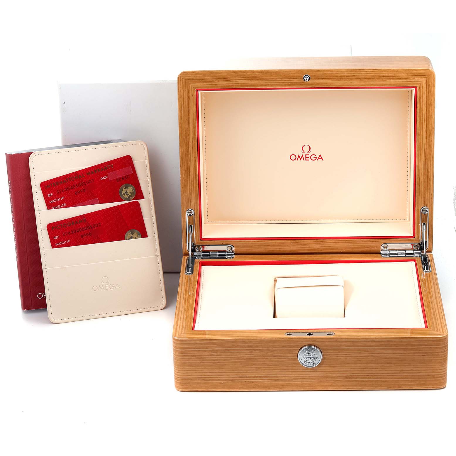 The image displays an Omega Speedmaster 326.30.40.50.01.002 Men's Stainless Steel Black Dial 326.30.40.50.01.002 Men's Stainless Steel Black Dial watch box, an open wooden case, and a cardholder with two red cards.