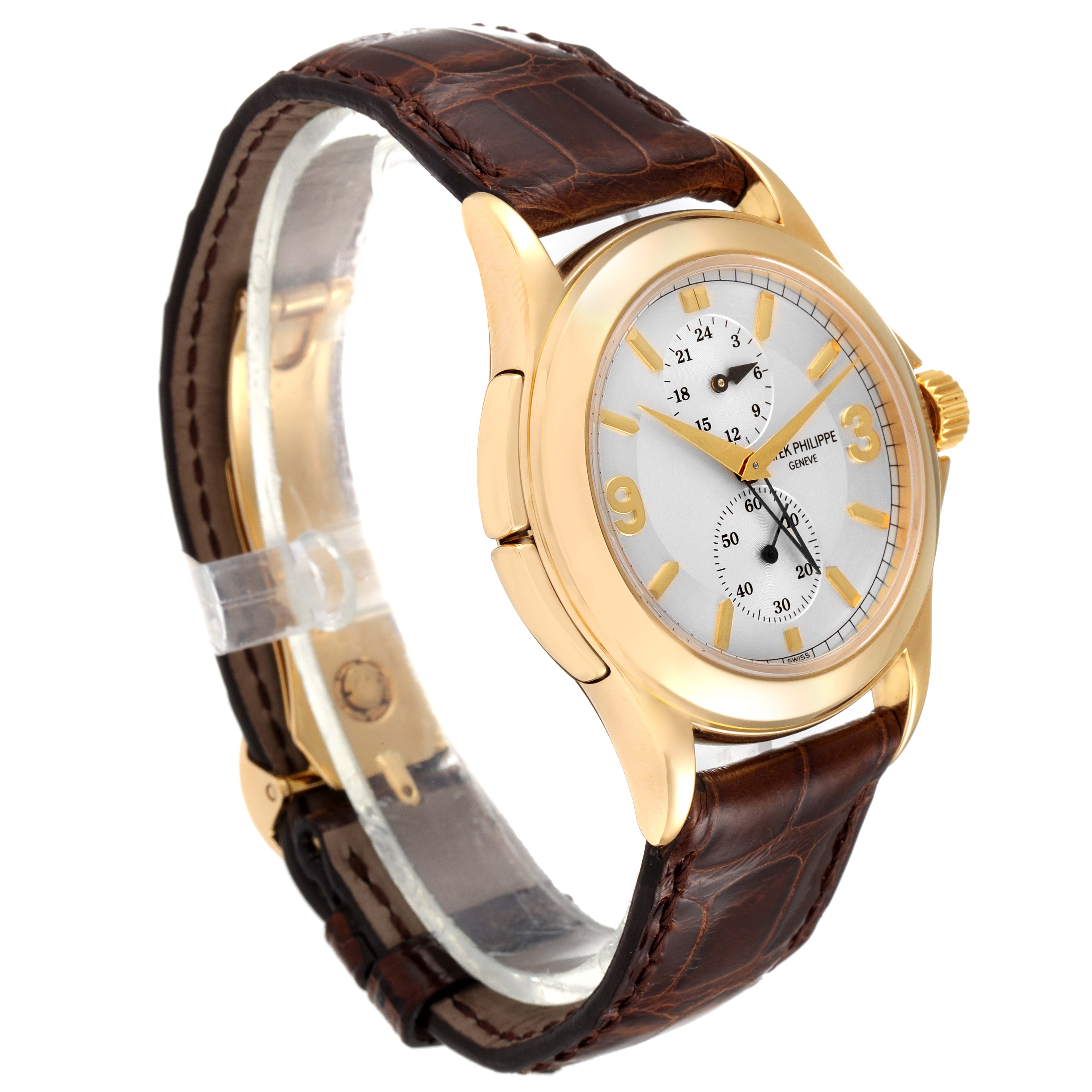 The image shows a side angle of a Patek Philippe Calatrava 5134J Men's Yellow Gold White Dial 5134J Men's Yellow Gold White Dial watch, highlighting its gold case, white dial, and brown leather strap.
