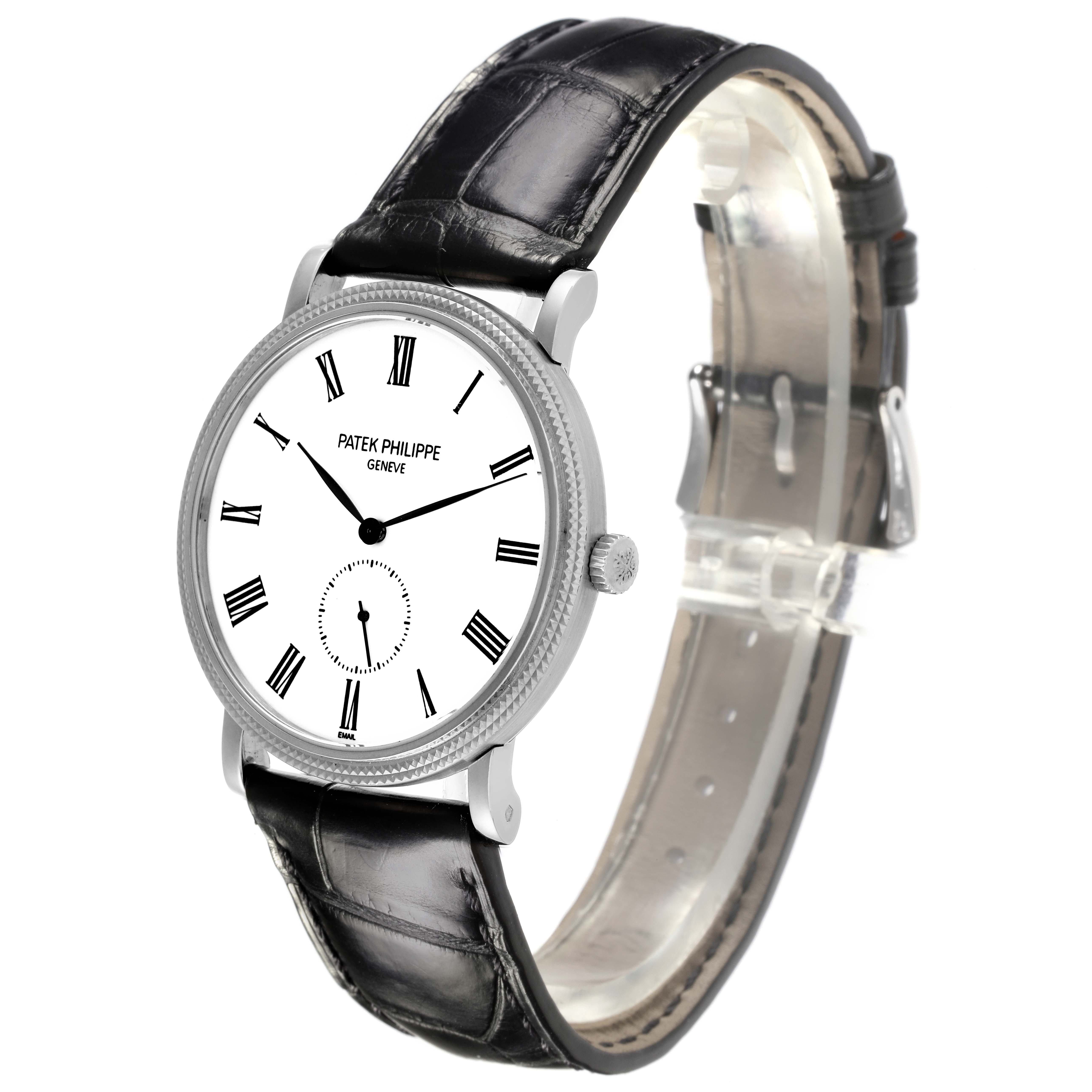 The Patek Philippe Calatrava 5116G Men's White Gold White Dial 5116G Men's White Gold White Dial watch is shown at a slight side angle, displaying the face, bezel, crown, and leather strap.