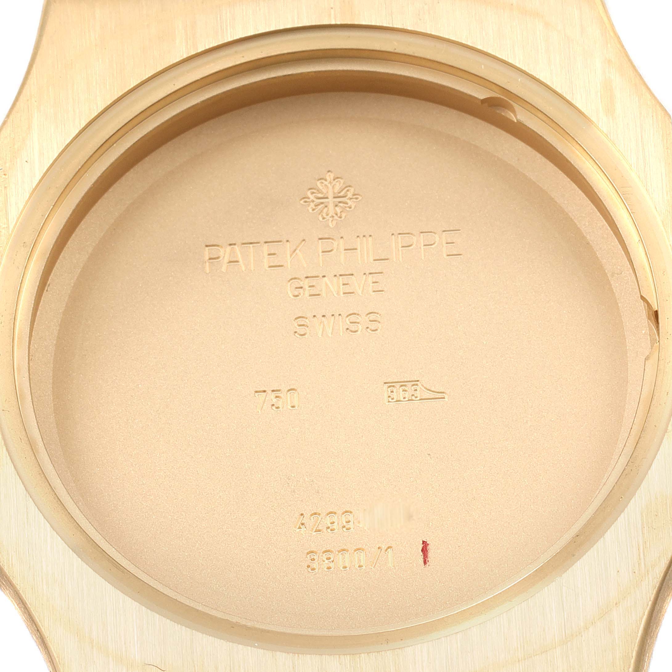 This image shows the back case of a Patek Philippe Nautilus 3800 Men's Yellow Gold White Dial 3800 Men's Yellow Gold White Dial watch, with the brand name and specifications engraved.