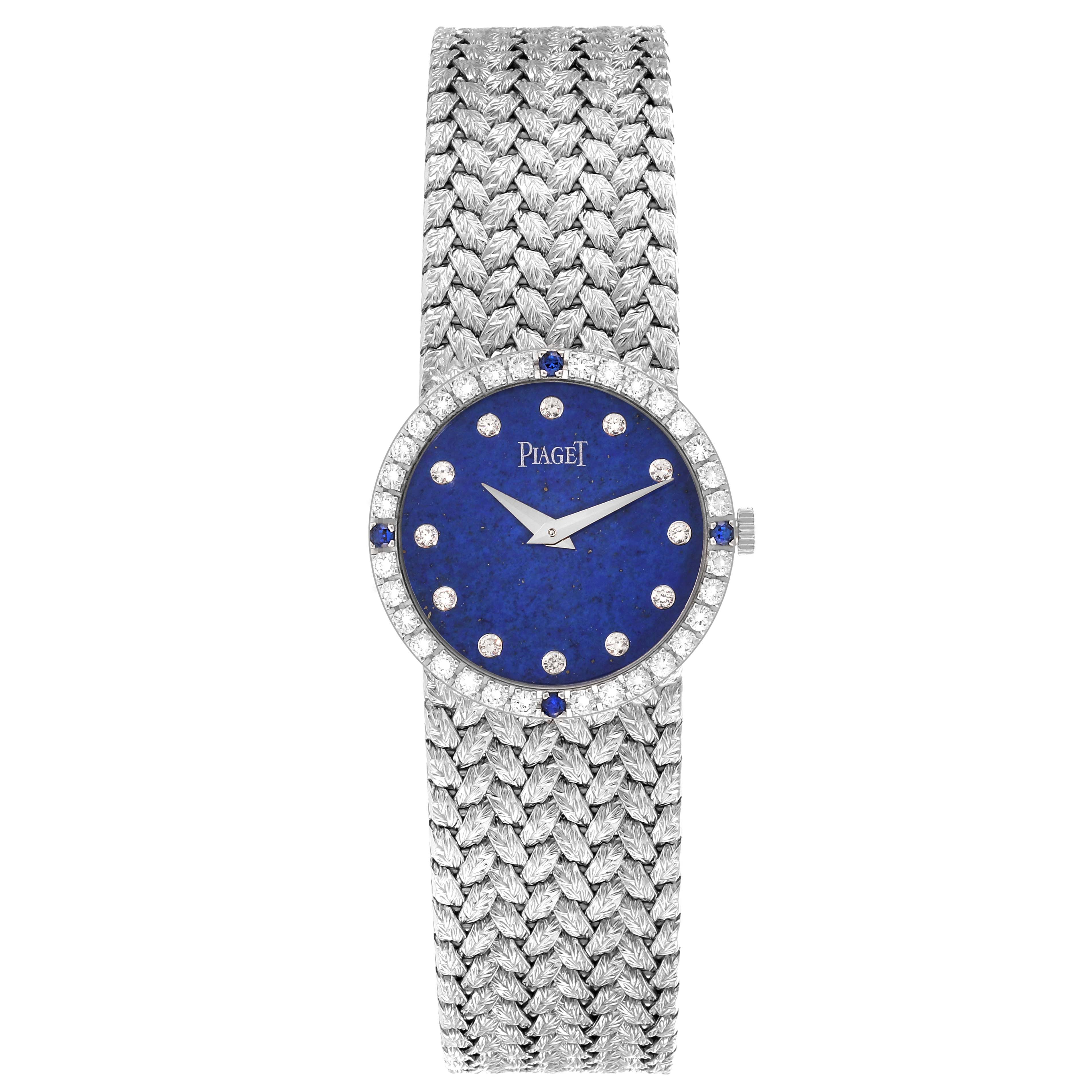 The Piaget 9706D2 Women's White Gold Blue Dial 9706D2 Women's White Gold Blue Dial Tradition 9706D2 watch is shown from a top view, displaying its blue diamond-studded dial and woven white gold bracelet.