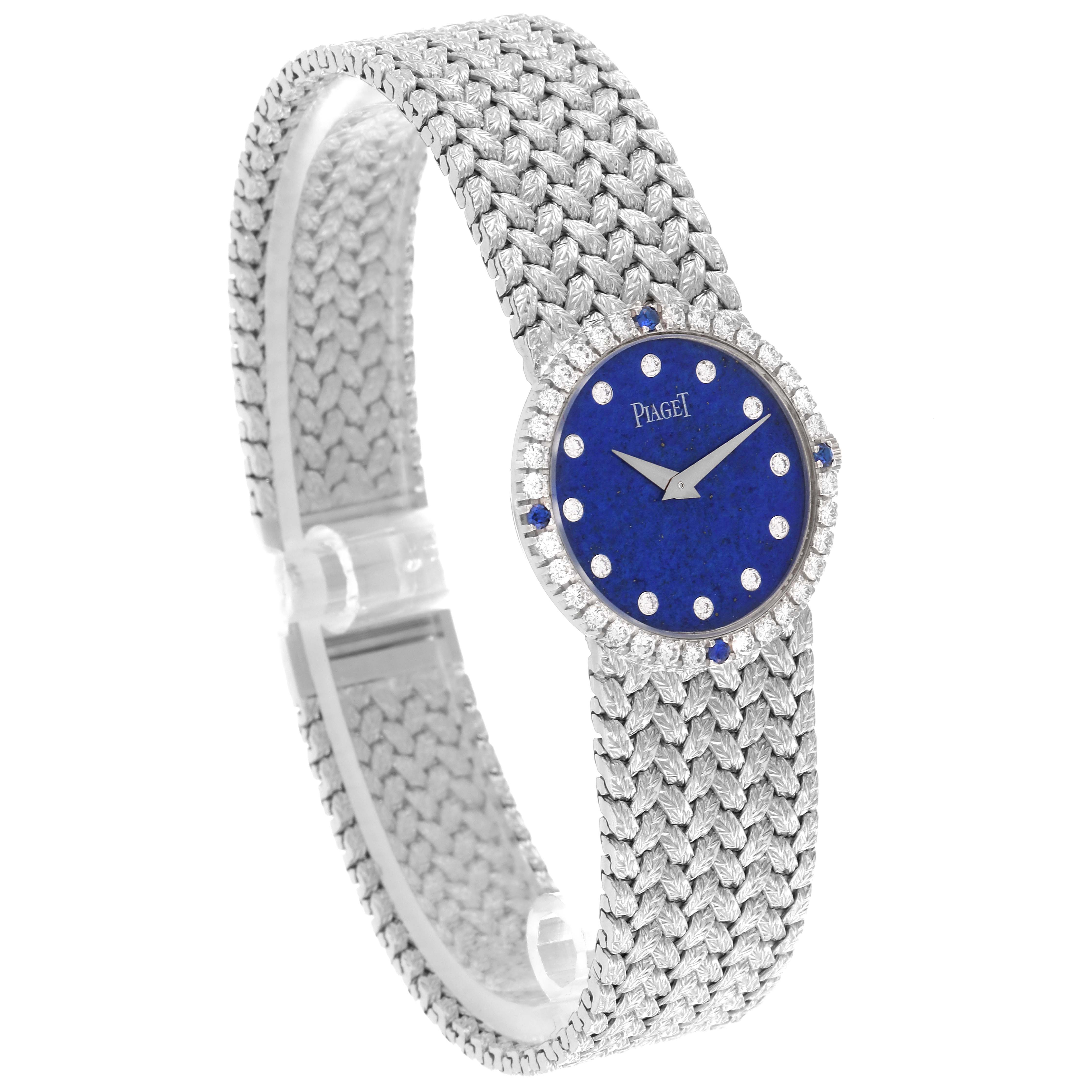 The Piaget 9706D2 Women's White Gold Blue Dial 9706D2 Women's White Gold Blue Dial Tradition 9706D2 watch is shown at an angle highlighting its dial, bezel, and elegant woven bracelet.