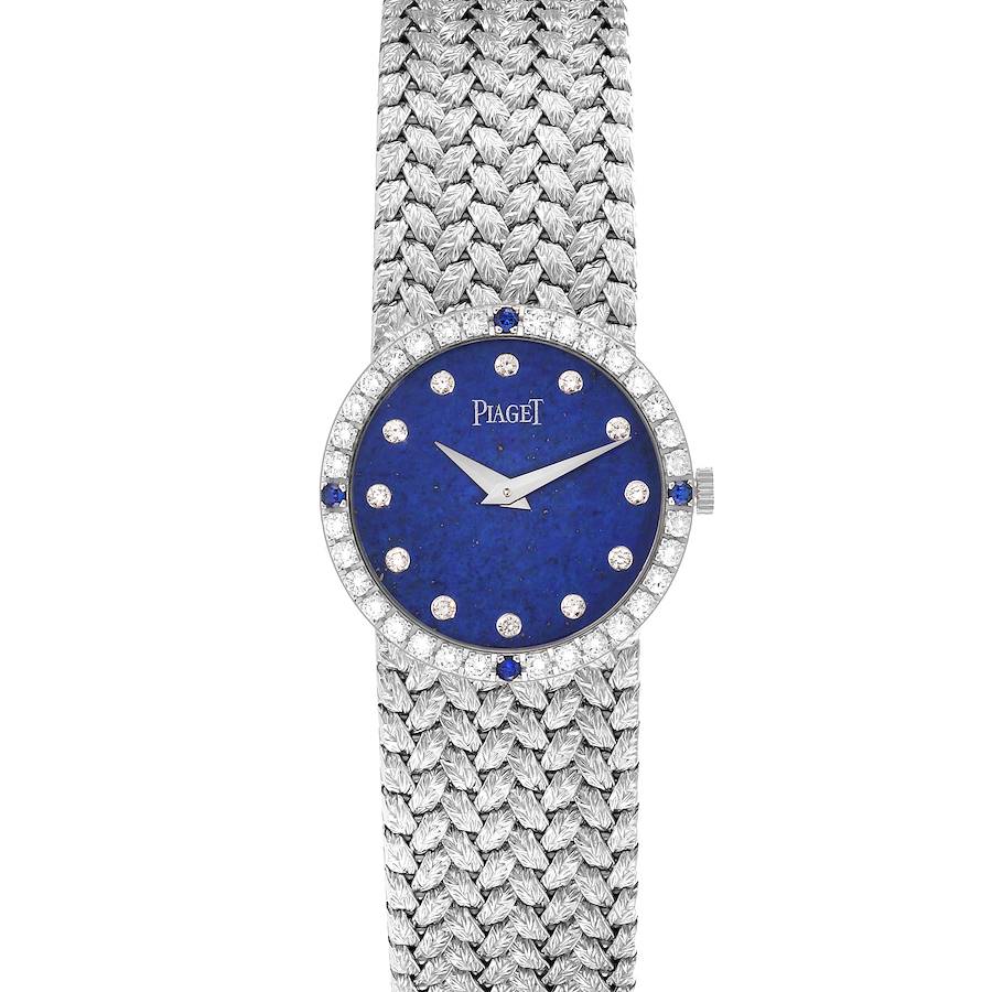 The Piaget Tradition 9706D2 watch is shown from the front, displaying its blue diamond dial and woven white gold bracelet.