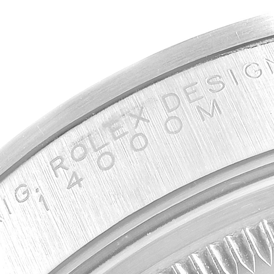 The image shows a close-up of the engraved bezel on the back of a Rolex Air-King 14000 Men's Stainless Steel Silver Dial 14000 Men's Stainless Steel Silver Dial watch.