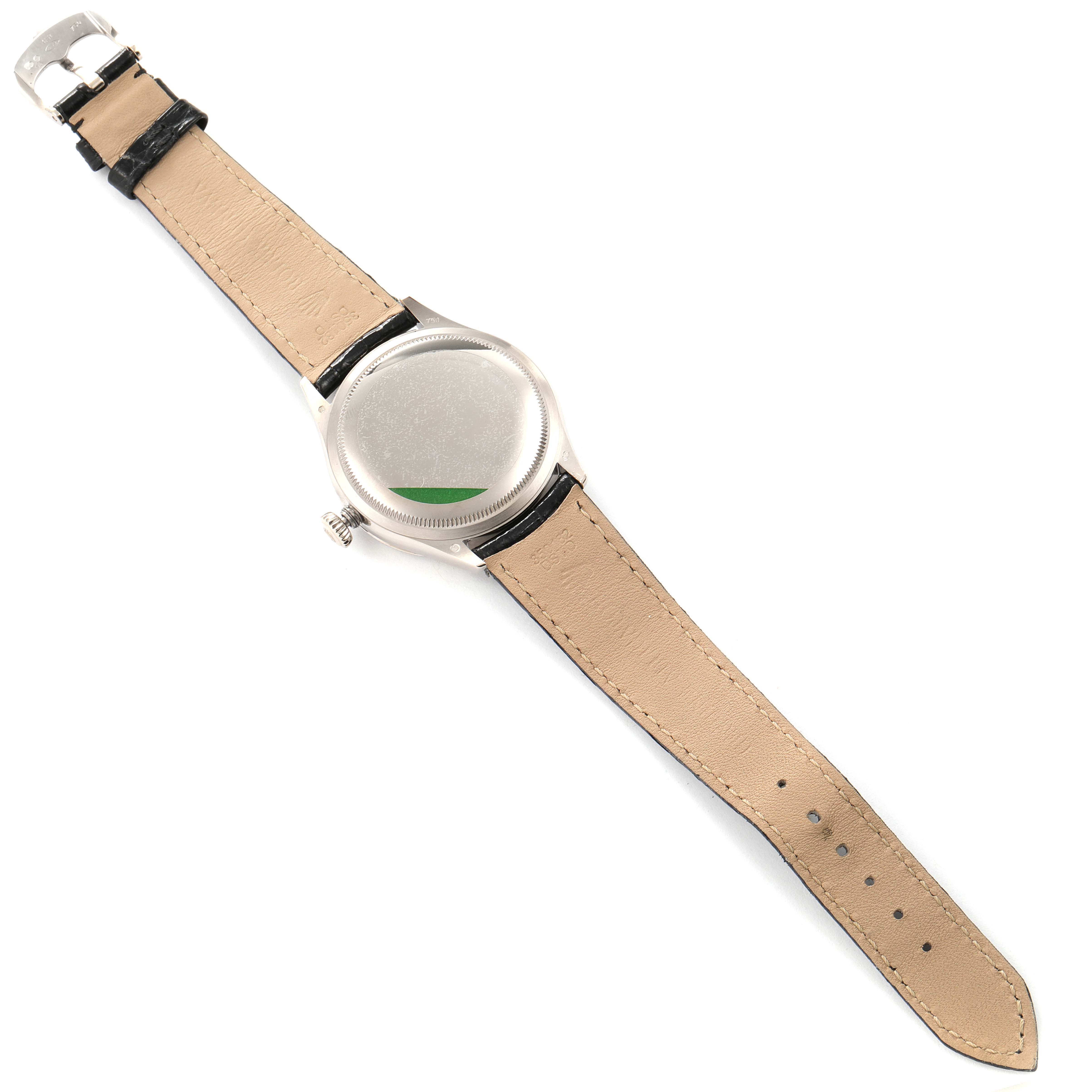 The image shows the back case and leather strap of a Rolex Cellini 50609RBR Men's White Gold Black Dial 50609RBR Men's White Gold Black Dial watch, laid flat with the bezel and buckle visible.