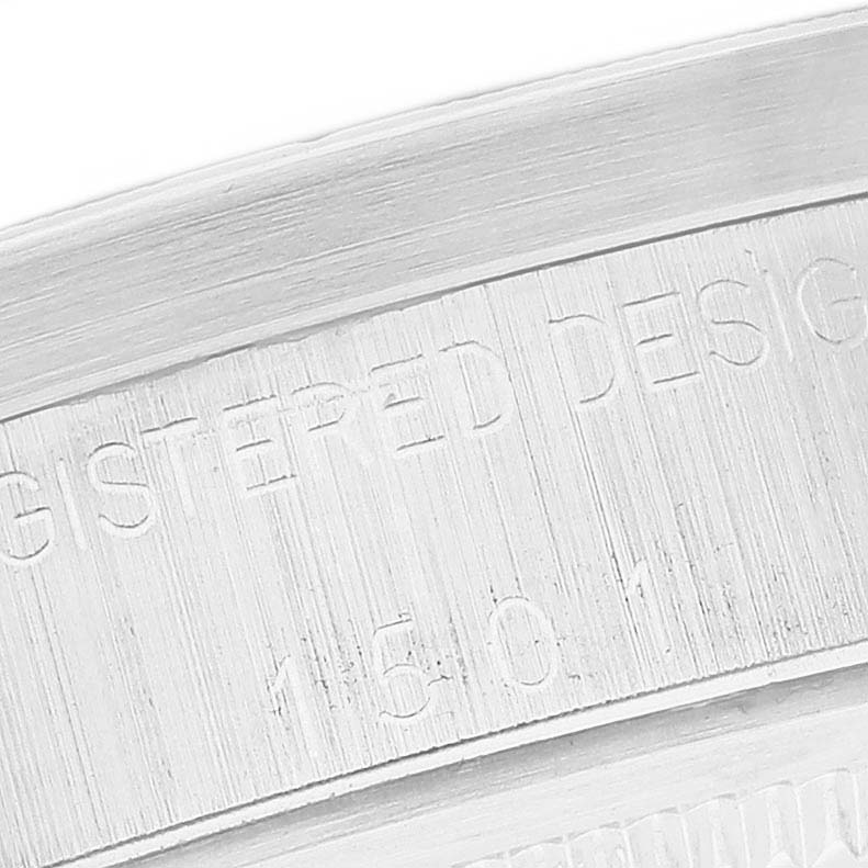 This close-up image shows the inner part of the bezel with engraved text on a Rolex Date 1501 Men's Stainless Steel Silver Dial 1501 Men's Stainless Steel Silver Dial model watch.