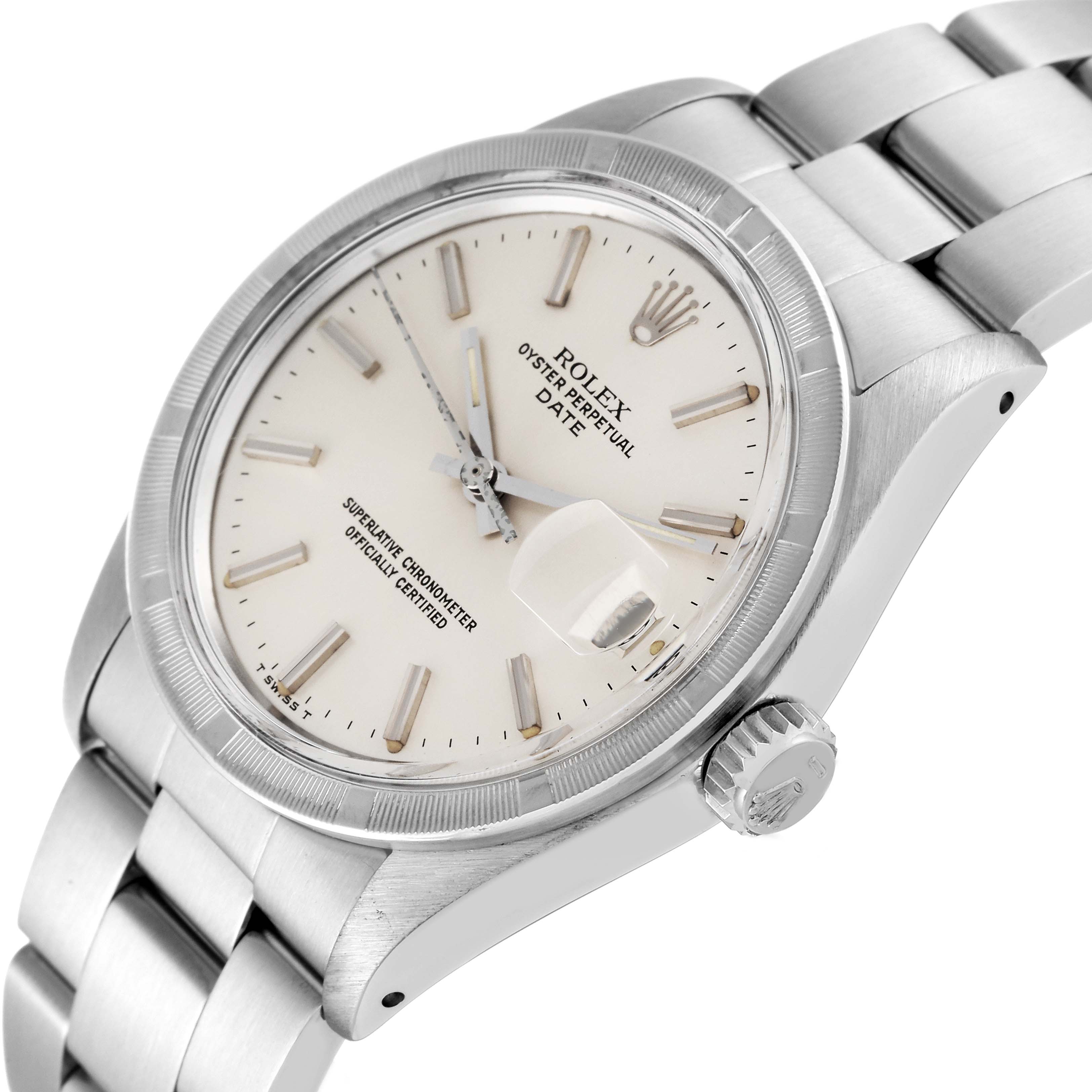 This image shows a Rolex Oyster Perpetual Date watch from a slight side angle, highlighting the dial, bezel, crown, and part of the bracelet.