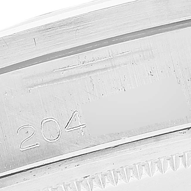 The image shows a close-up of the engraved serial number on the case of a Rolex Date 1501 Men's Stainless Steel Grey Dial 1501 Men's Stainless Steel Grey Dial model watch.