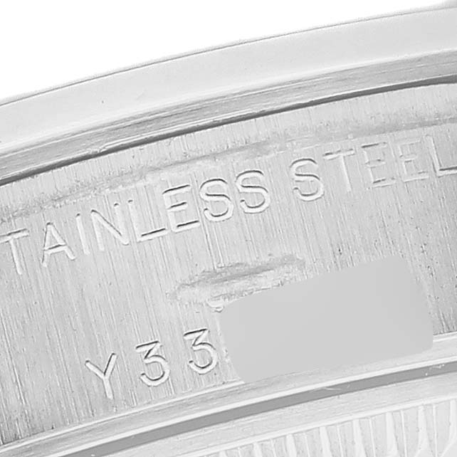 This image shows a close-up of the inner caseback edge, displaying the serial number and "STAINLESS STEEL" text of a Rolex Date 79160 Women
s Stainless Steel White Dial 79160 Women
s Stainless Steel White Dial model watch.