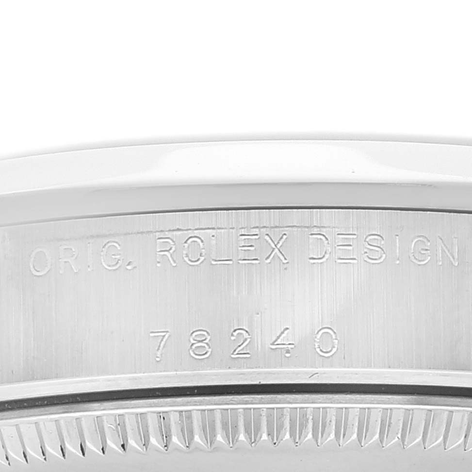 This is a close-up of the case back edge of a Mid-Size Rolex watch, showing its model number 78240 and design engraving.