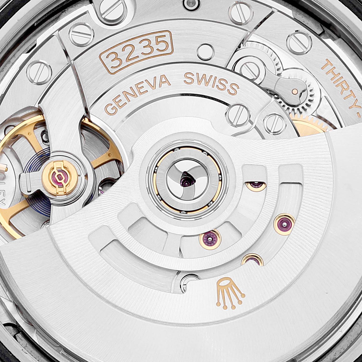 This image shows a close-up of the Datejust 41 Rolex movement, highlighting components like the rotor and engraved text.