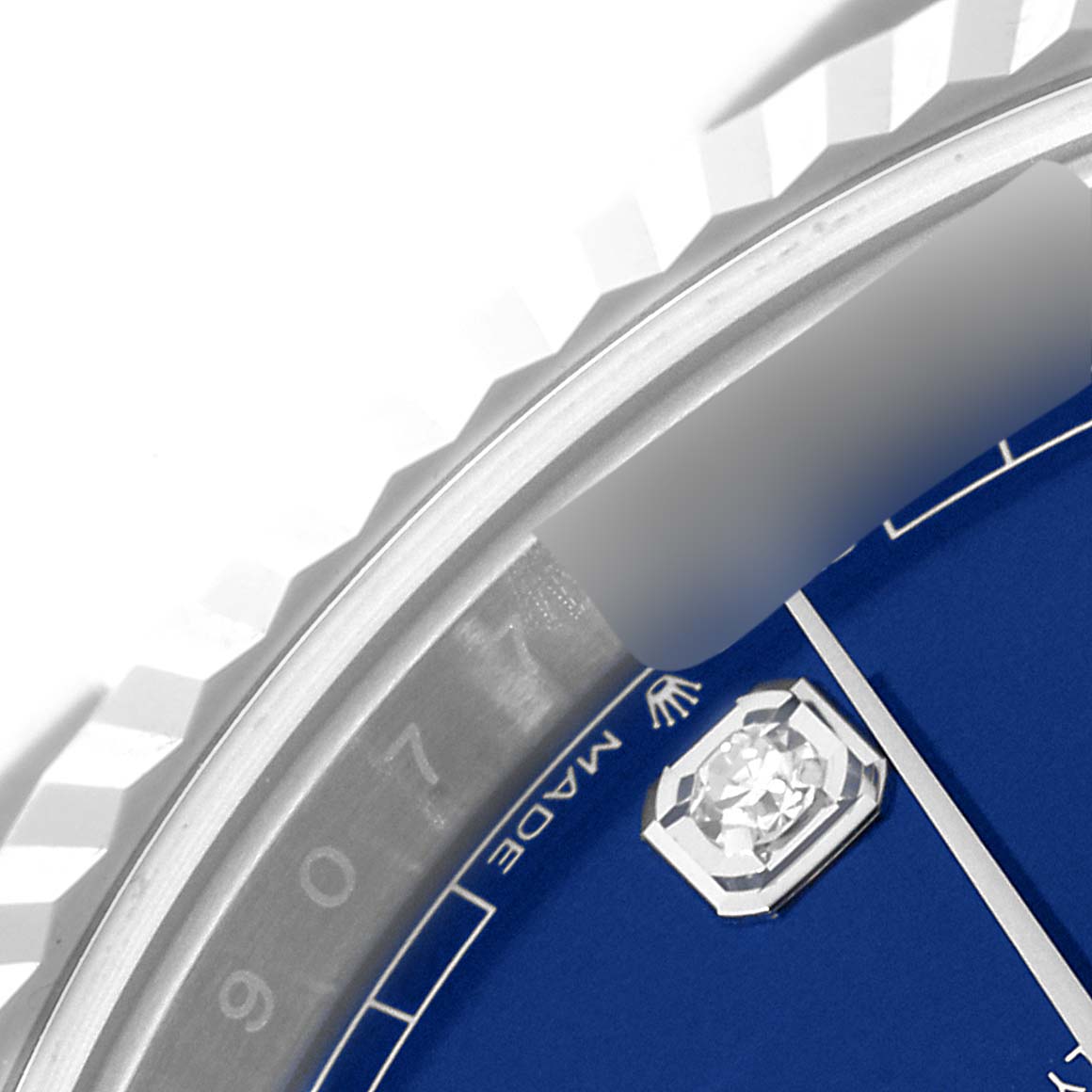 The image shows a close-up of the bezel and part of the dial, including a diamond marker, of the Rolex Datejust 41 126334 Men's Stainless Steel Blue Dial 126334 Men's Stainless Steel Blue Dial watch.