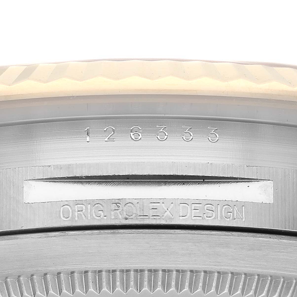 This image shows a close-up of the case back and serial number of a Rolex Datejust 41 126333 Men's Steel and Gold (two tone) Black Dial 126333 Men's Steel and Gold (two tone) Black Dial watch.
