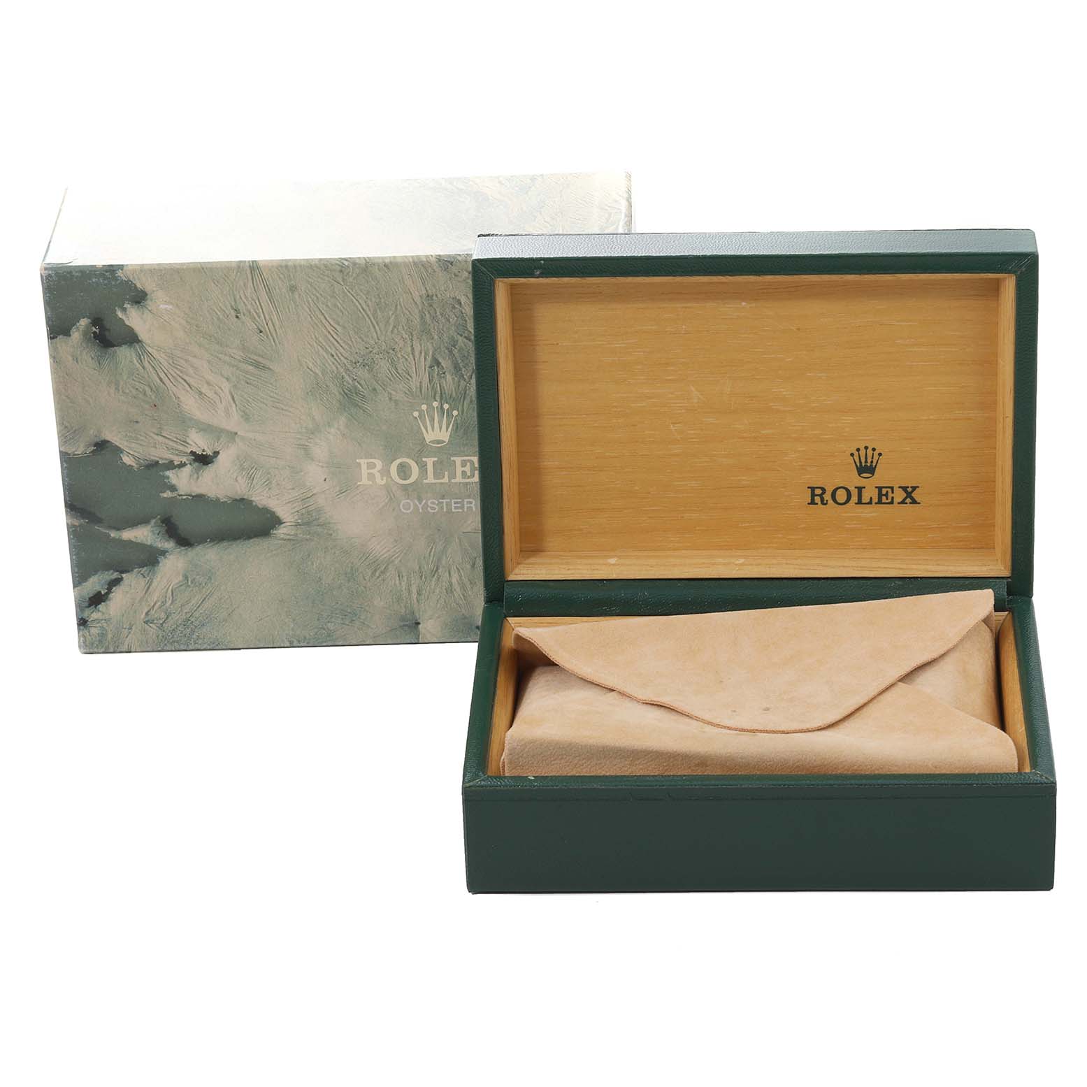 The image shows a green Rolex box open with a beige interior, likely housing the watch, alongside its outer packaging for the Vintage Collection model.