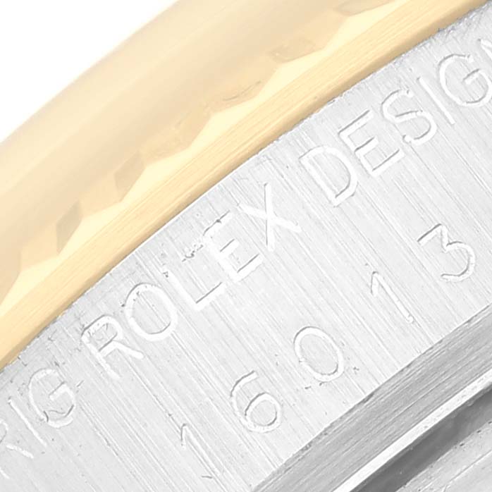 The image shows a close-up of the engraved side of the casing from the Vintage Collection model by Rolex.