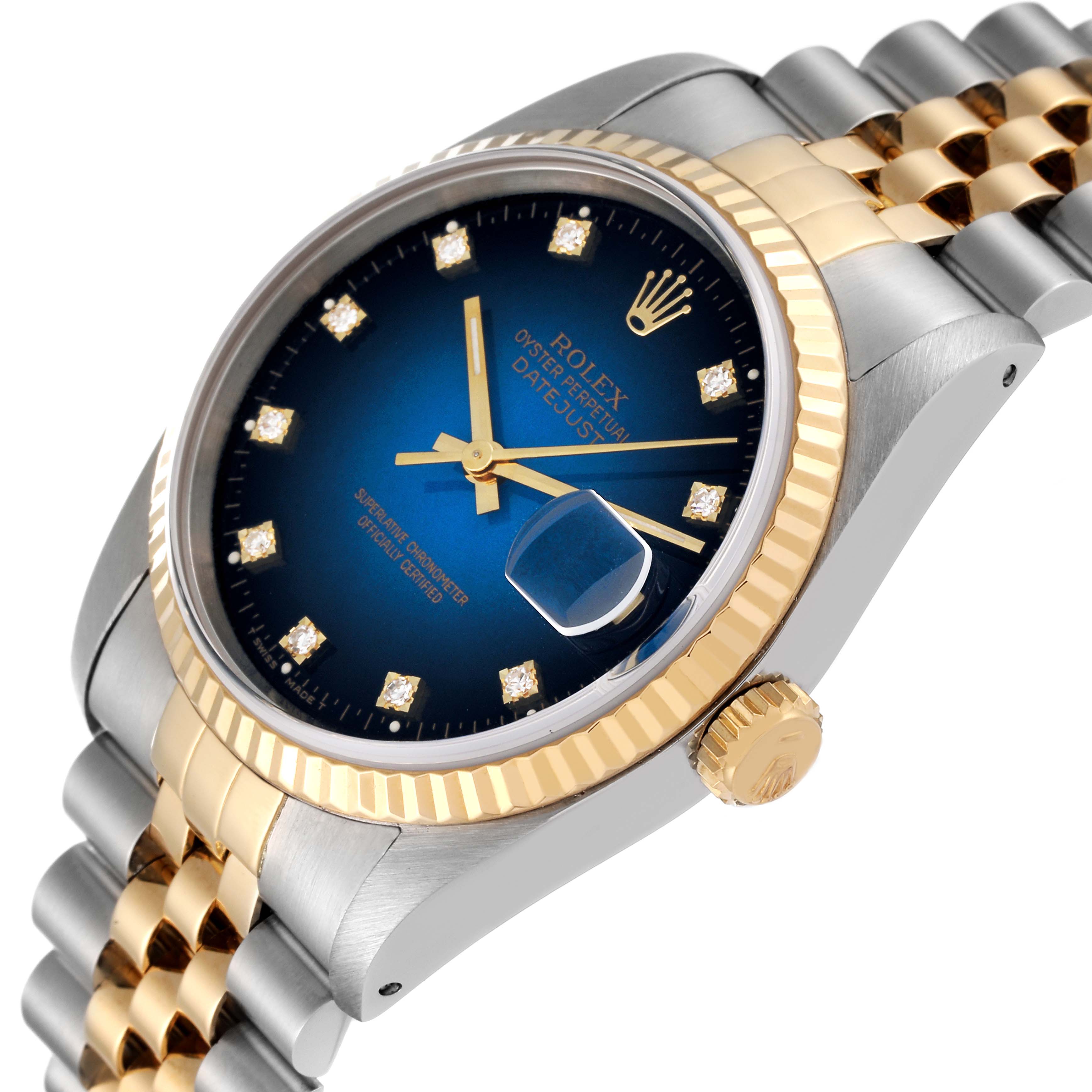 The Rolex Datejust 16233G Men's Steel and Gold (two tone) Blue Dial 16233G Men's Steel and Gold (two tone) Blue Dial model is shown at an angled view highlighting its dial, fluted bezel, and part of the bracelet.