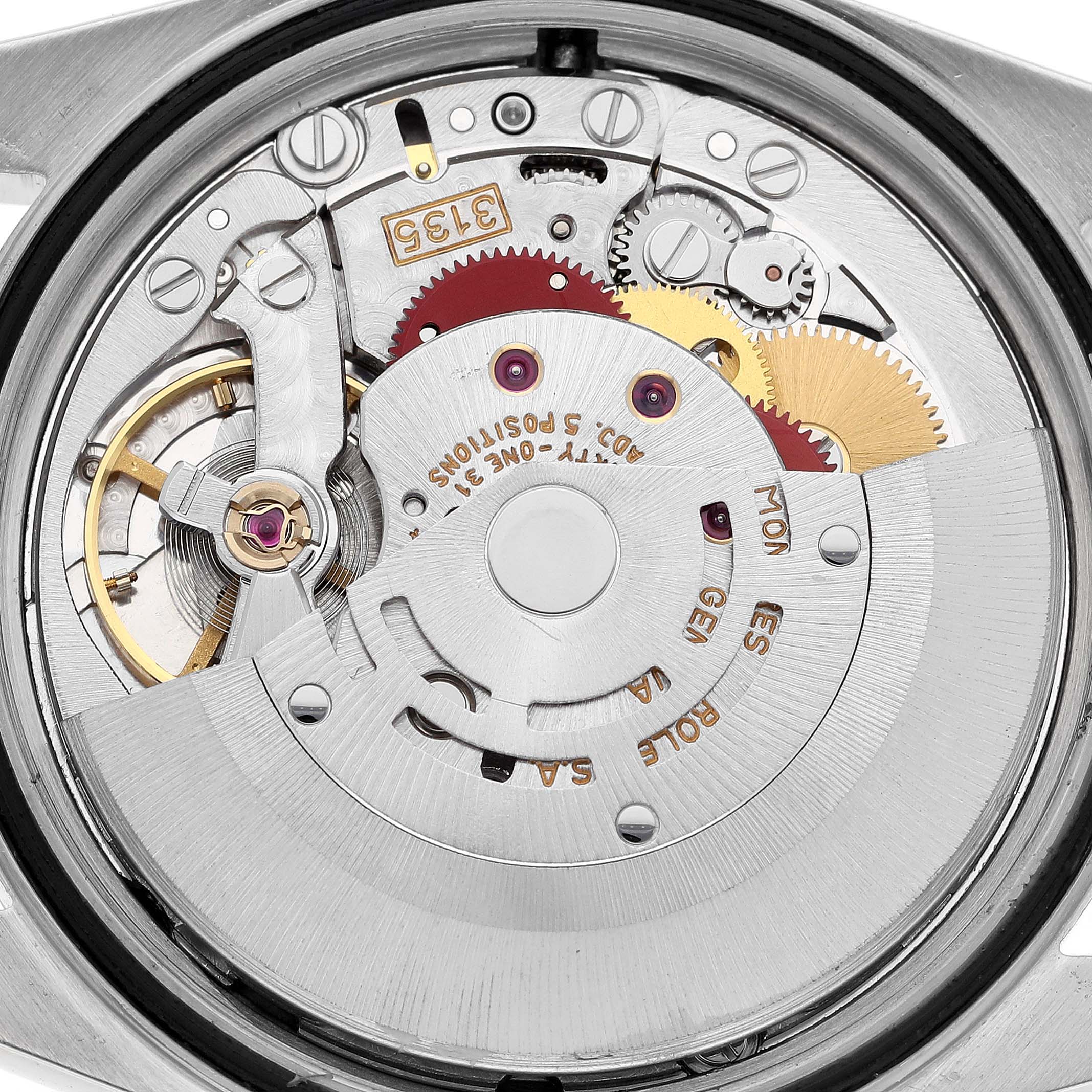 The image shows an overhead view of the movement mechanism of a Rolex Datejust 16233G Men's Steel and Gold (two tone) Blue Dial 16233G Men's Steel and Gold (two tone) Blue Dial watch.