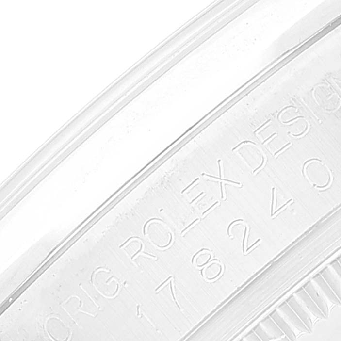 This image shows a close-up of the engraved serial number on the case of a Rolex Mid-Size 178240 Women's Stainless Steel Silver Dial 178240 Women's Stainless Steel Silver Dial model watch.