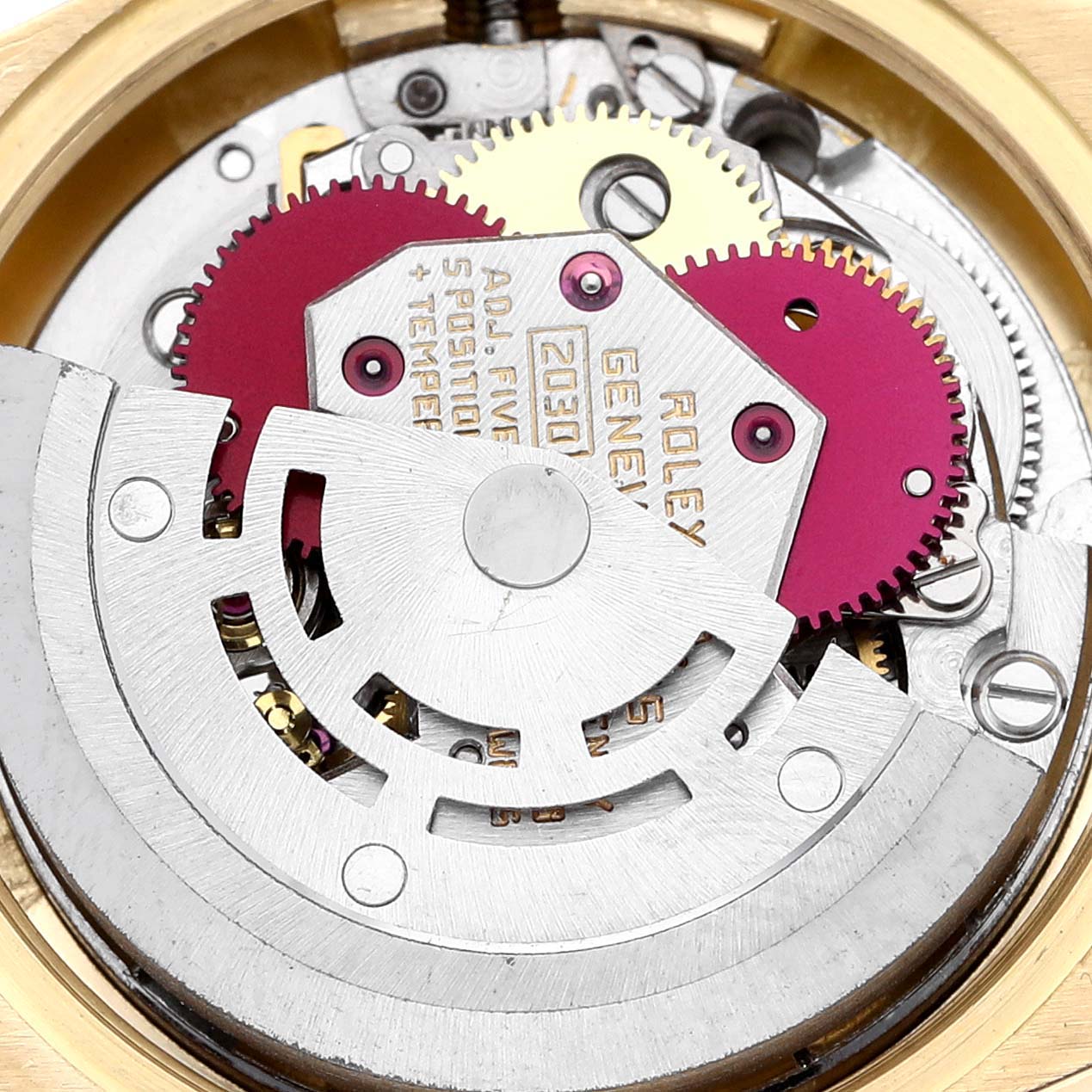 This image shows the intricate internal mechanics of a Rolex President 6917 Women's Yellow Gold Silver Dial 6917 Women's Yellow Gold Silver Dial model, highlighting the gears and movements in close-up.